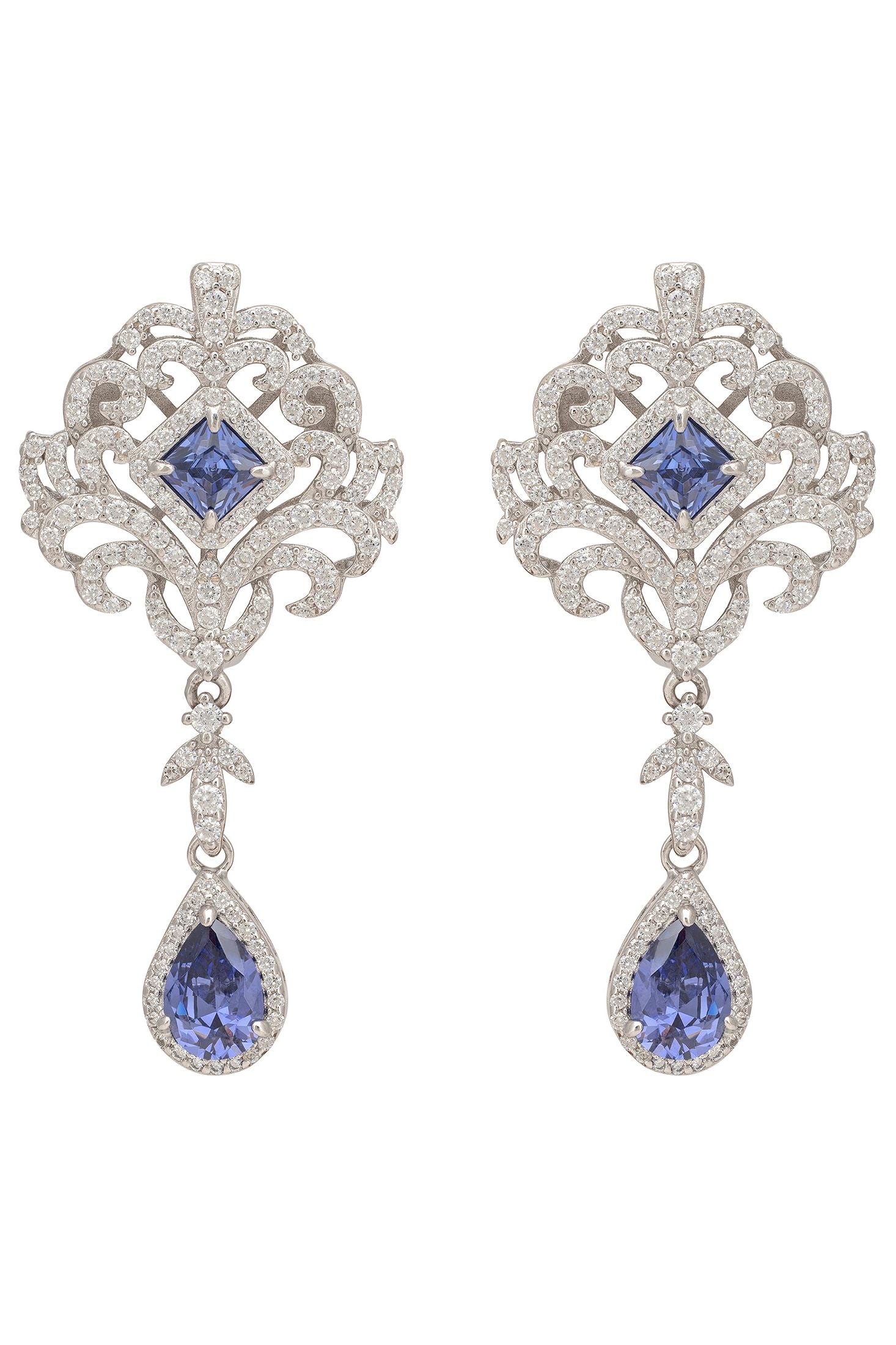 Pair of silver earrings with blue gemstones on a white background