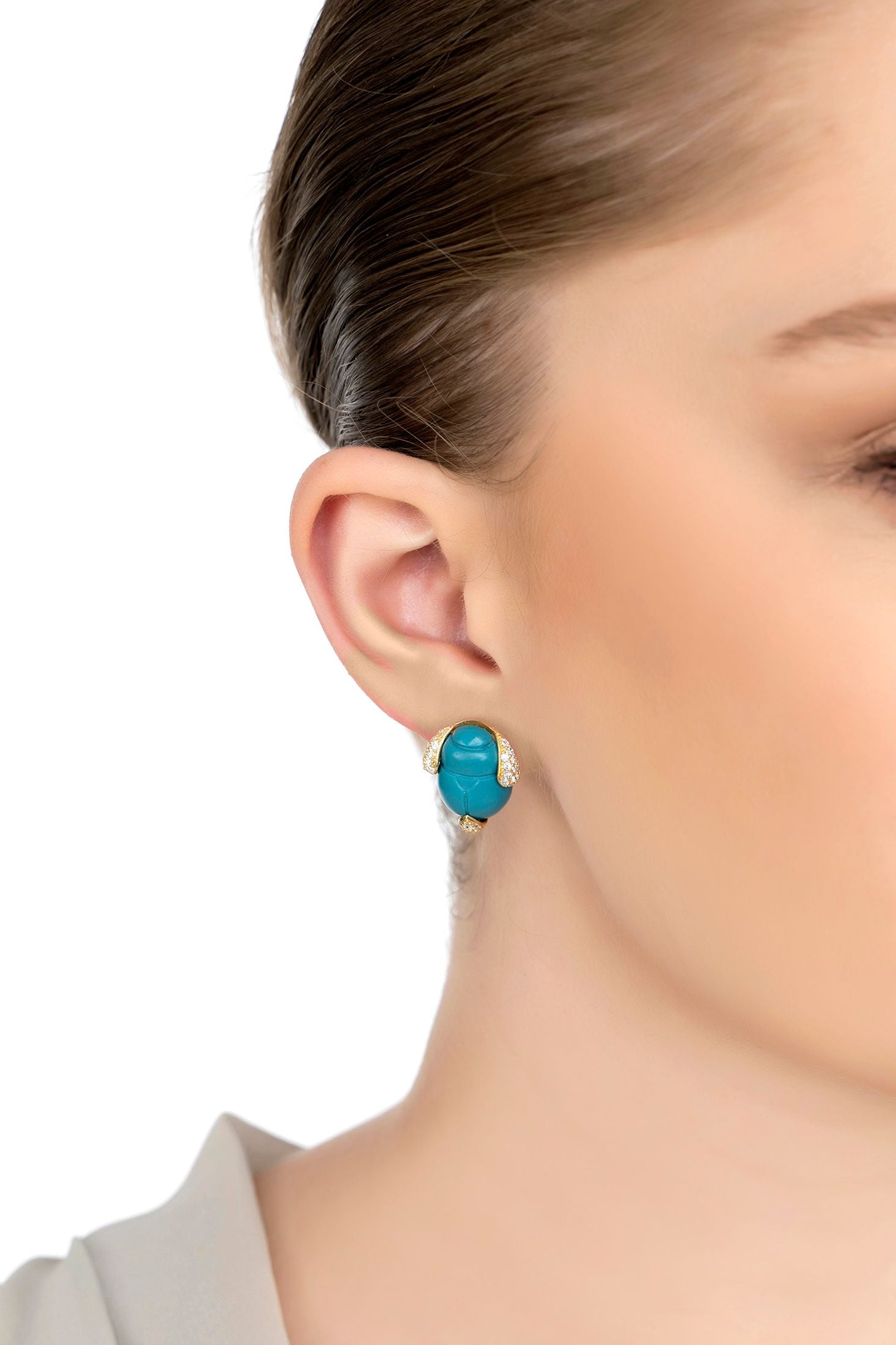 The earring worn by a model.