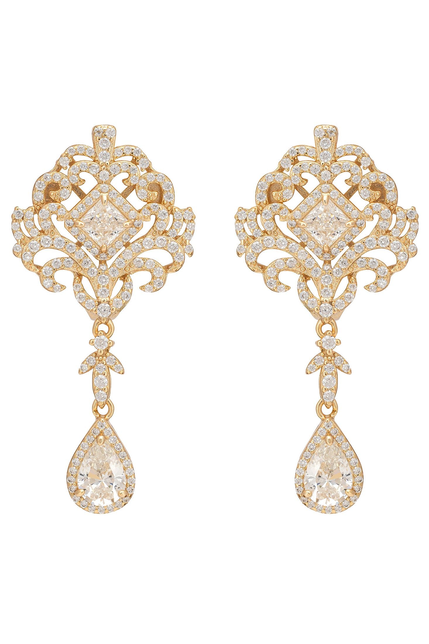 Pair of gold earrings with intricate designs on a white background