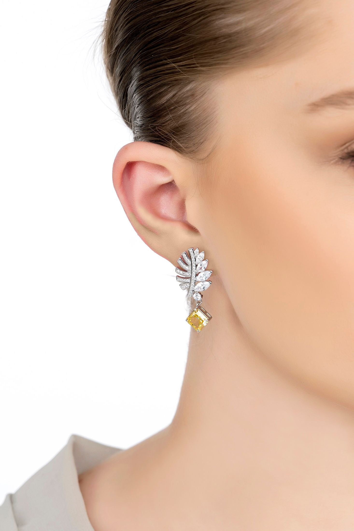 The earring worn by a model.