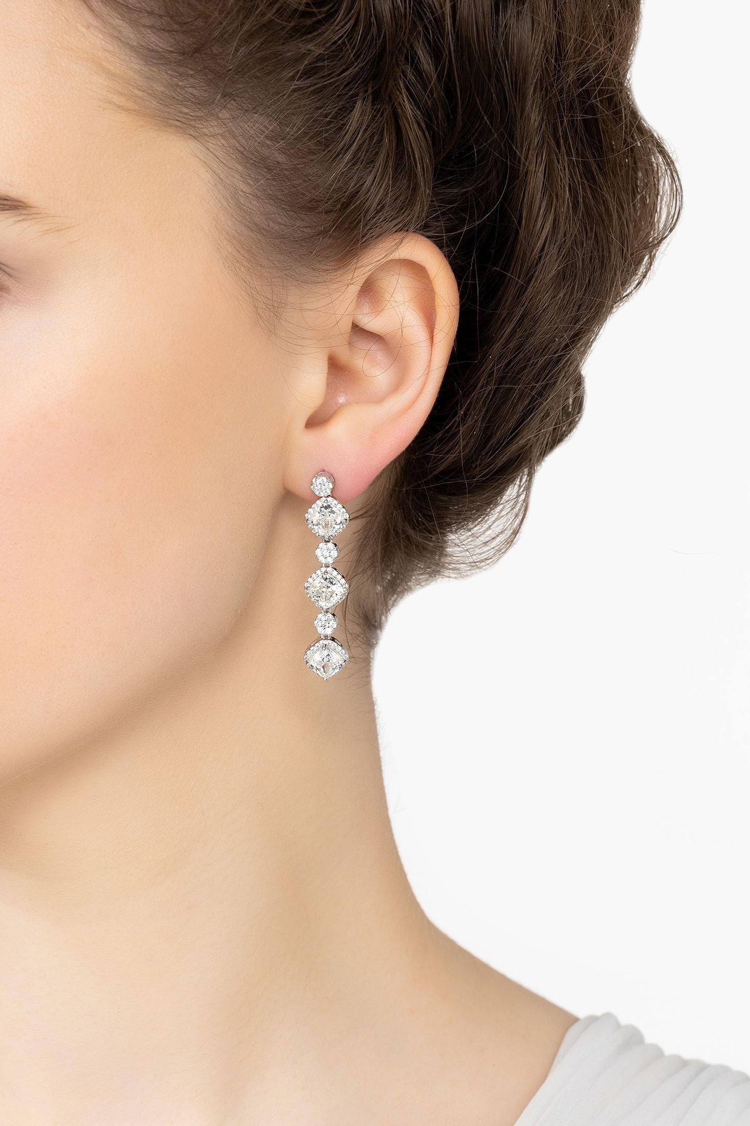 Angled view of Elena Drop Earrings Moissanite Silver, showing silver finish and the jewellery profile.