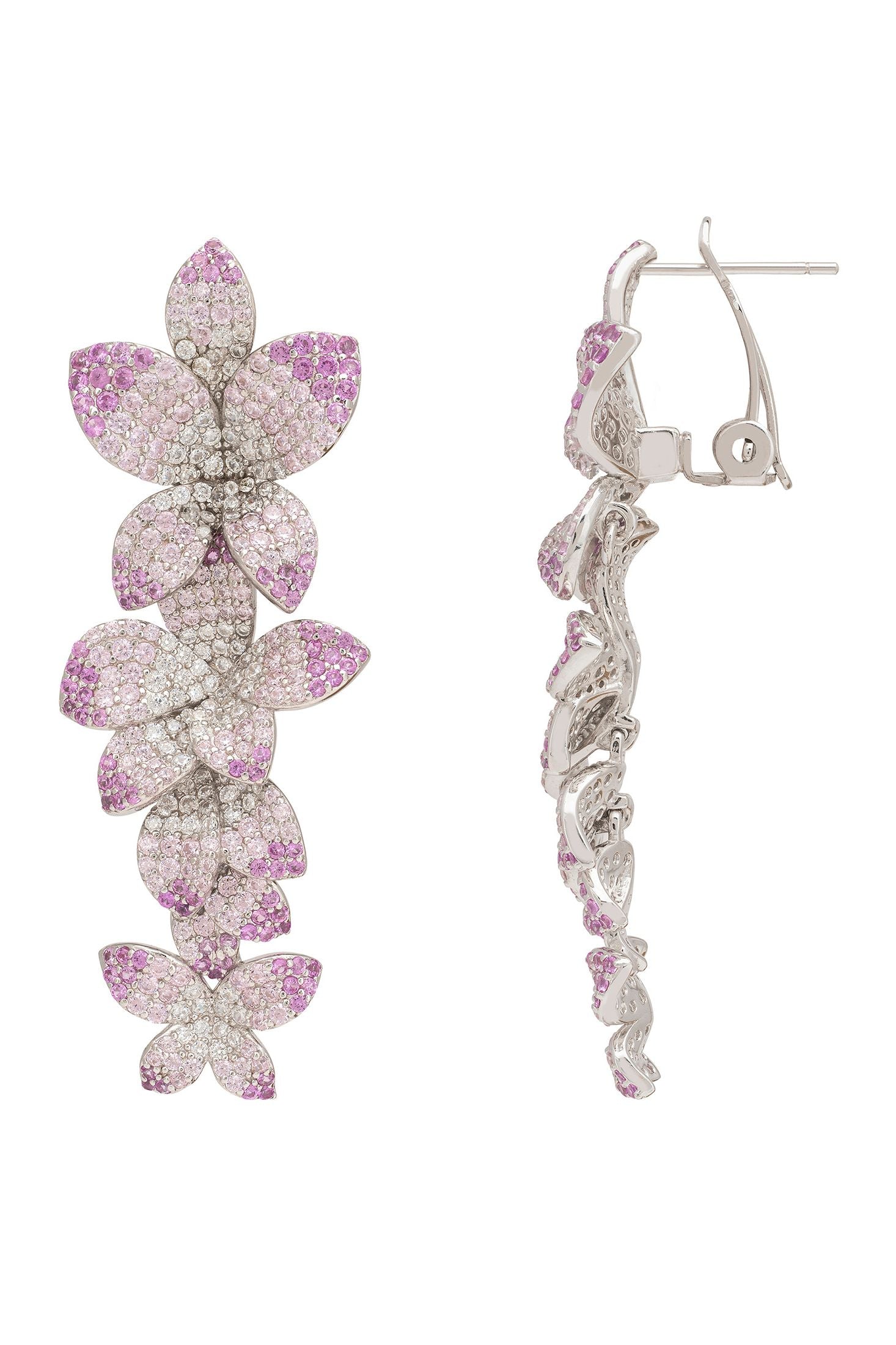 Flower-shaped earrings with purple and clear gemstones on a white background