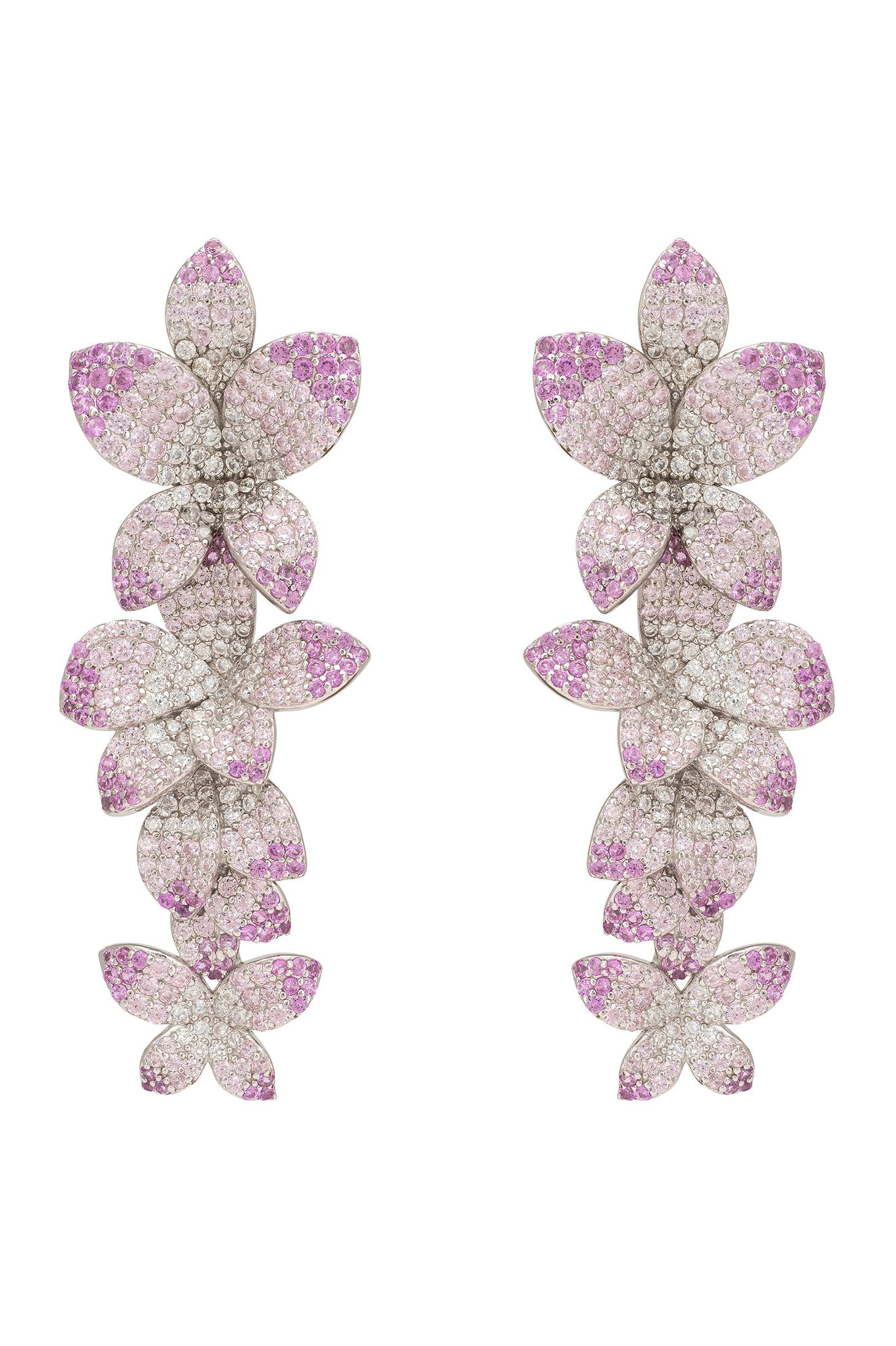 Orchid-shaped earrings with pink and purple gemstones on a white background