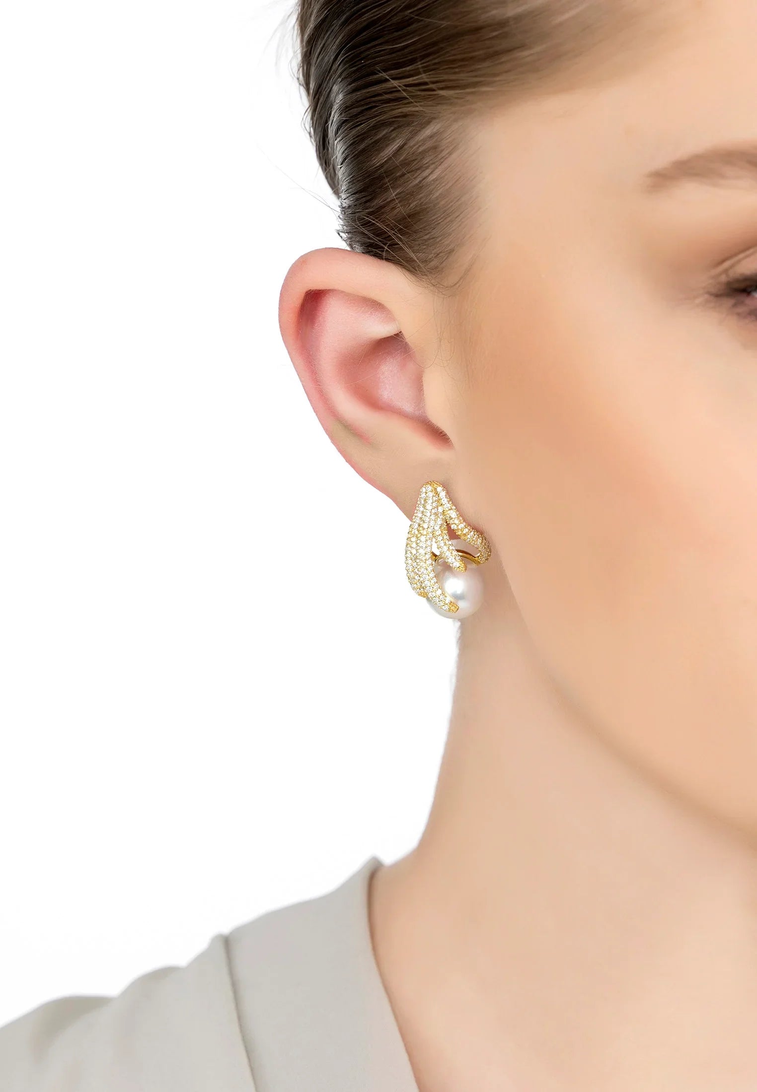 The earring worn by a model.
