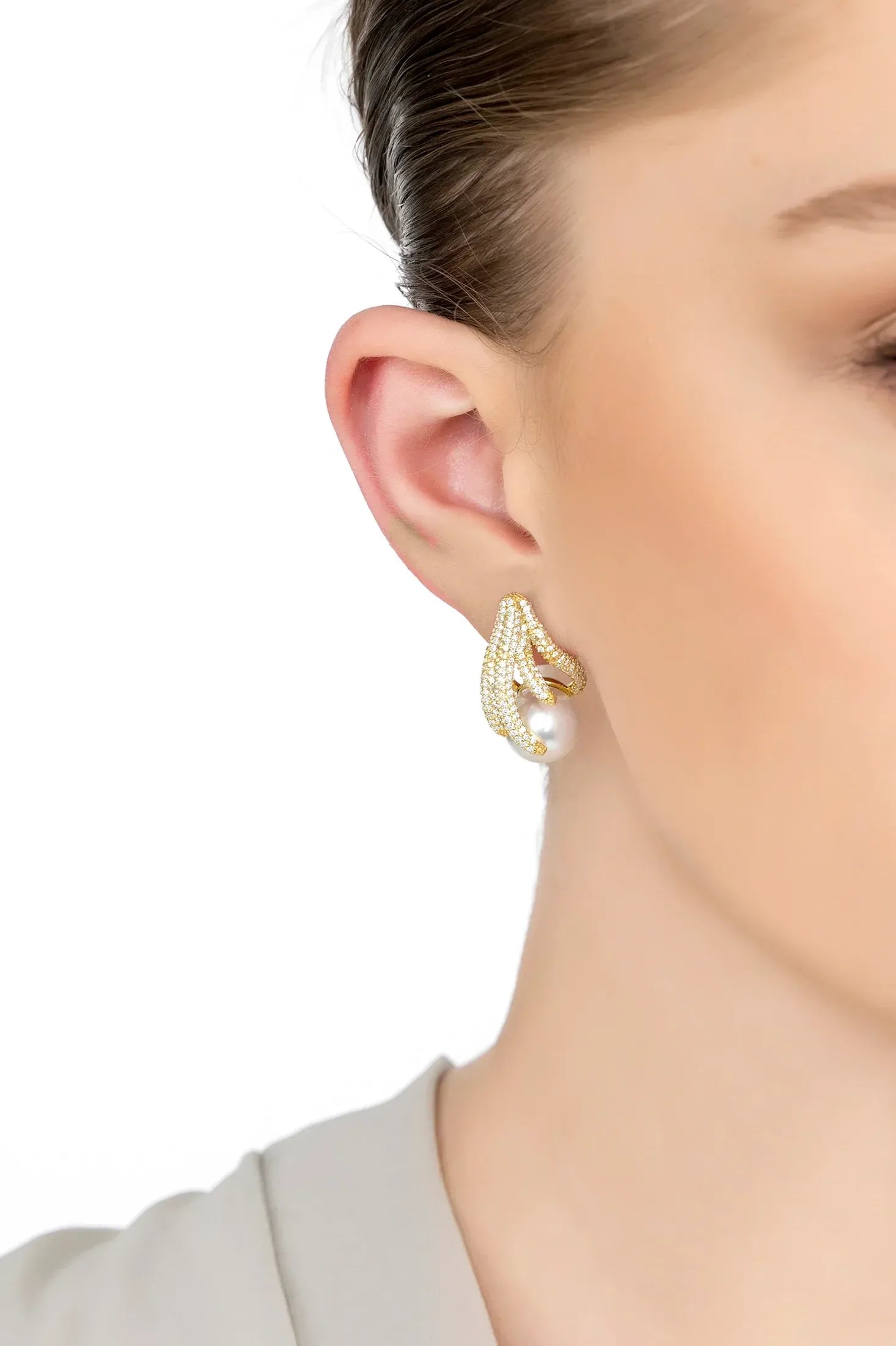 The earring worn by a model.