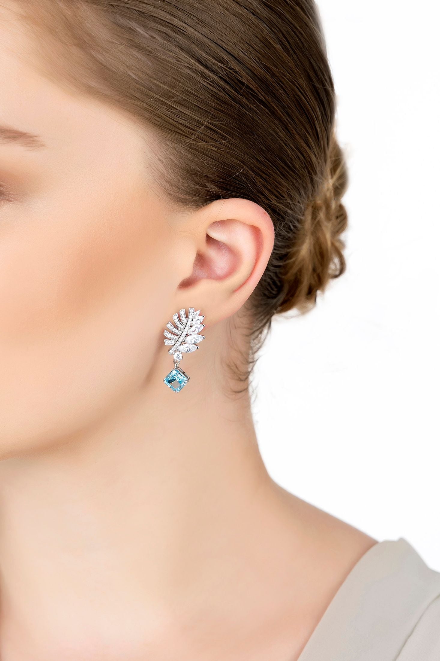 The earring worn by a model.
