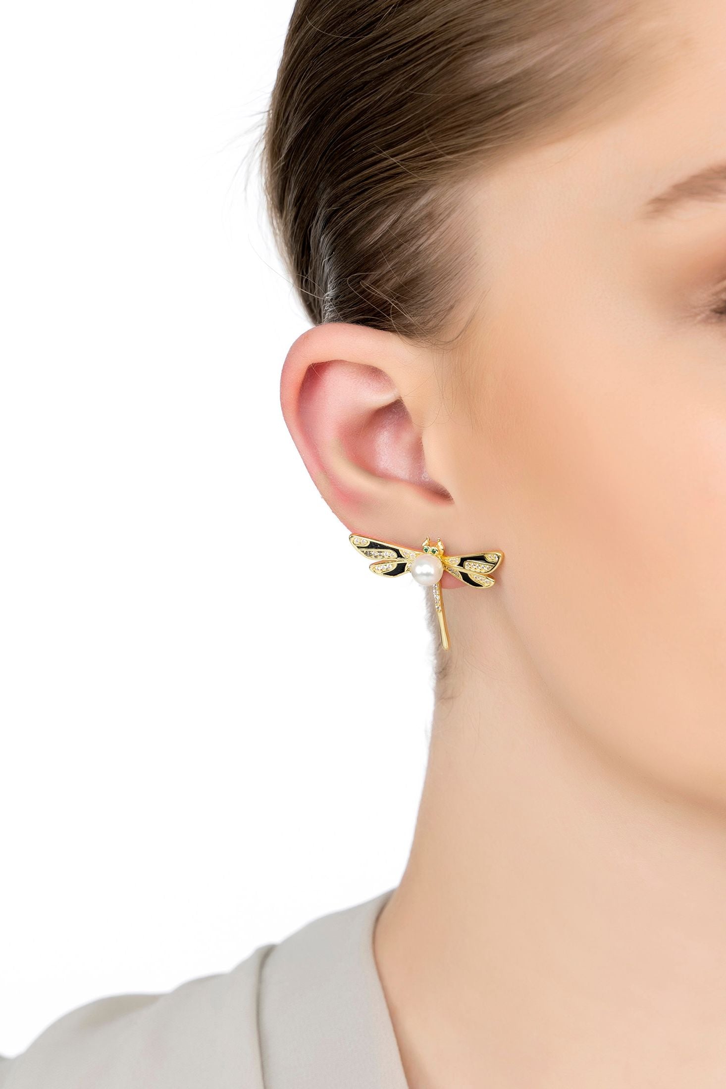 The earring worn by a model.