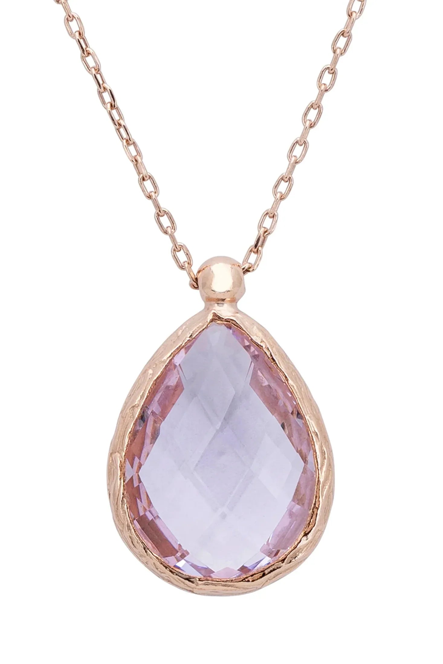 Close-up of the teardrop rose quartz rose gold pendant.