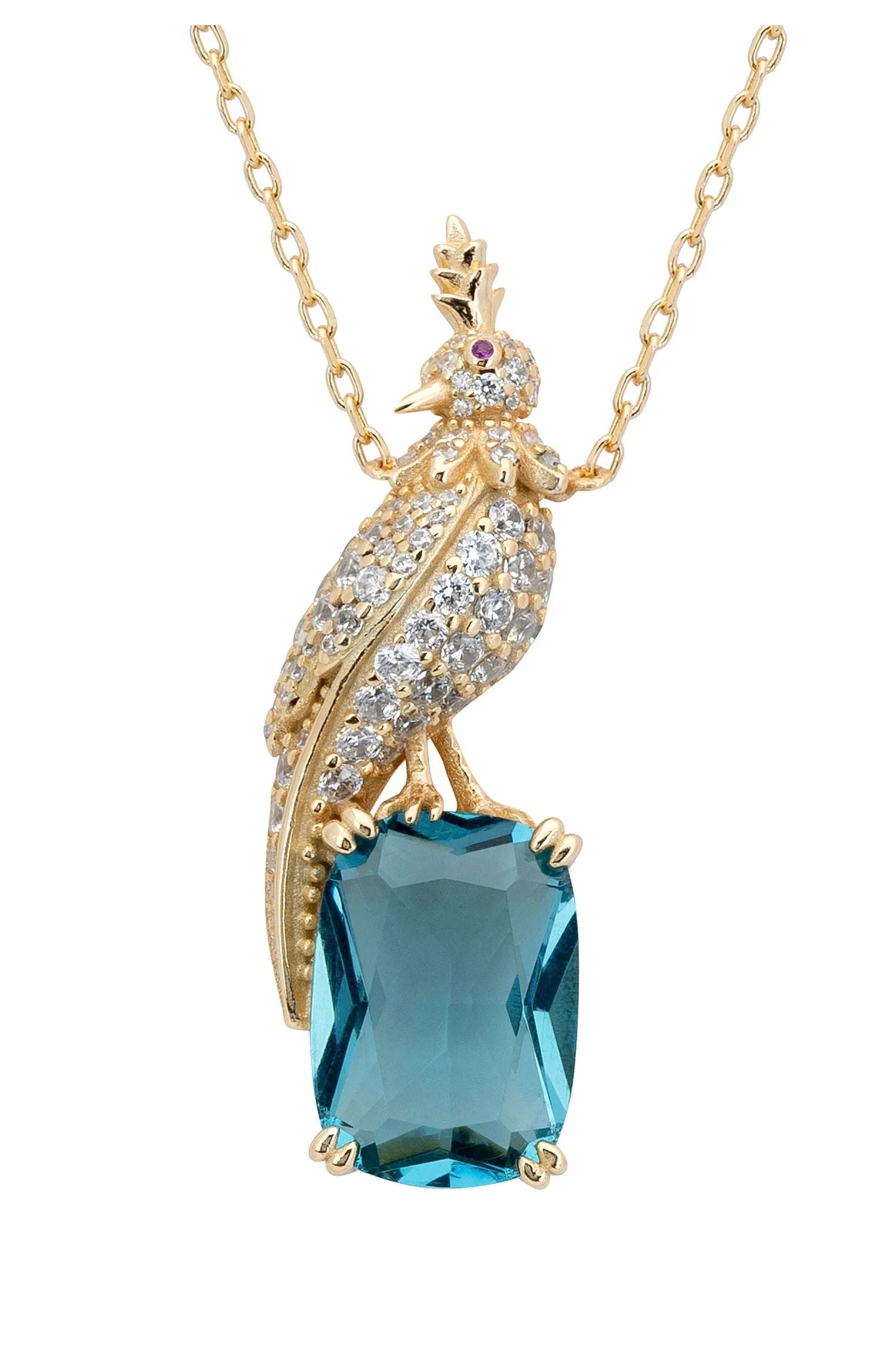 Close-up of the diamond and gold bird perched on a blue gemstone charm.
