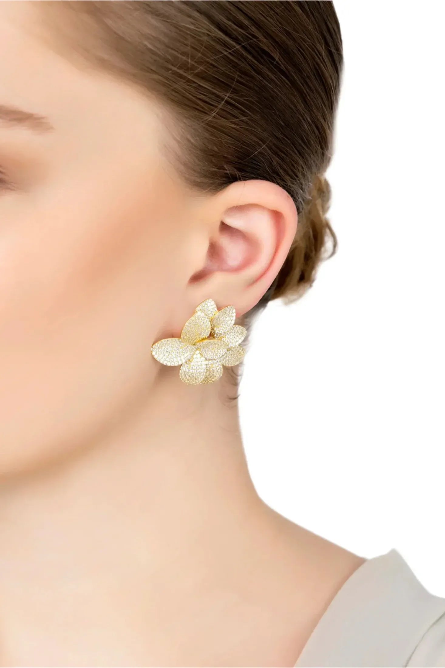 The earring worn by a model.
