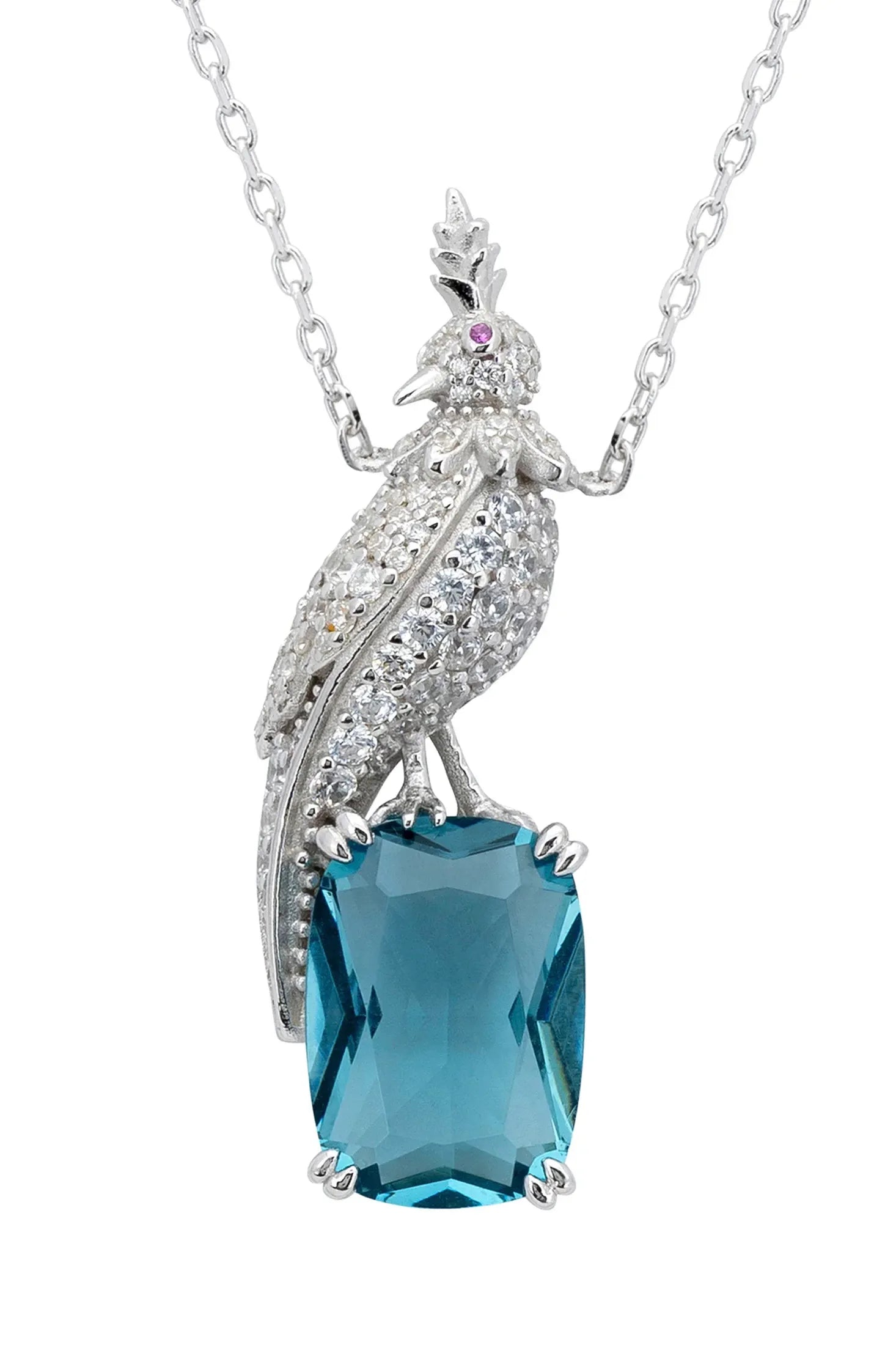 Close-up of the diamond bird perched on a blue gemstone.