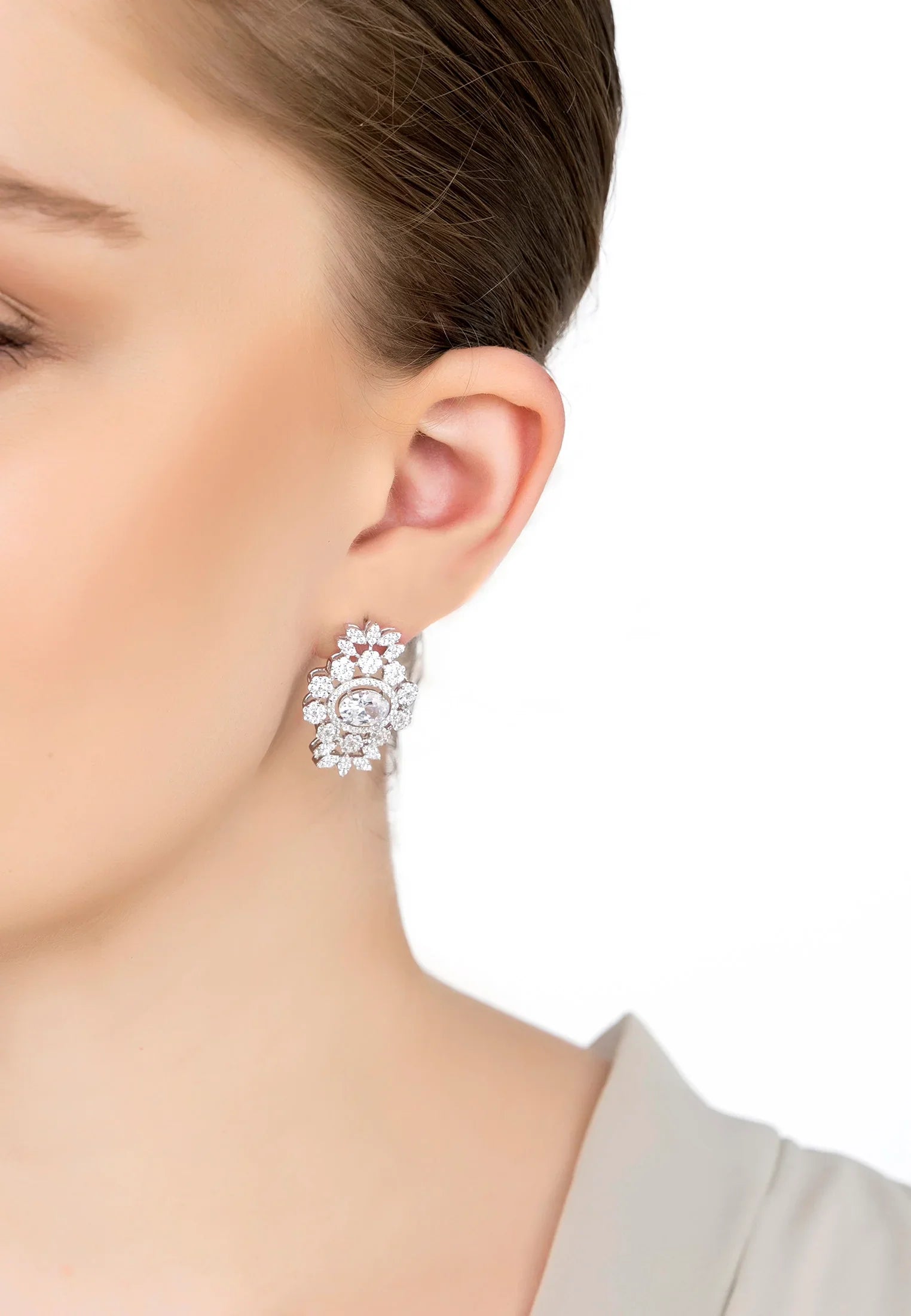 The earring worn by a model.