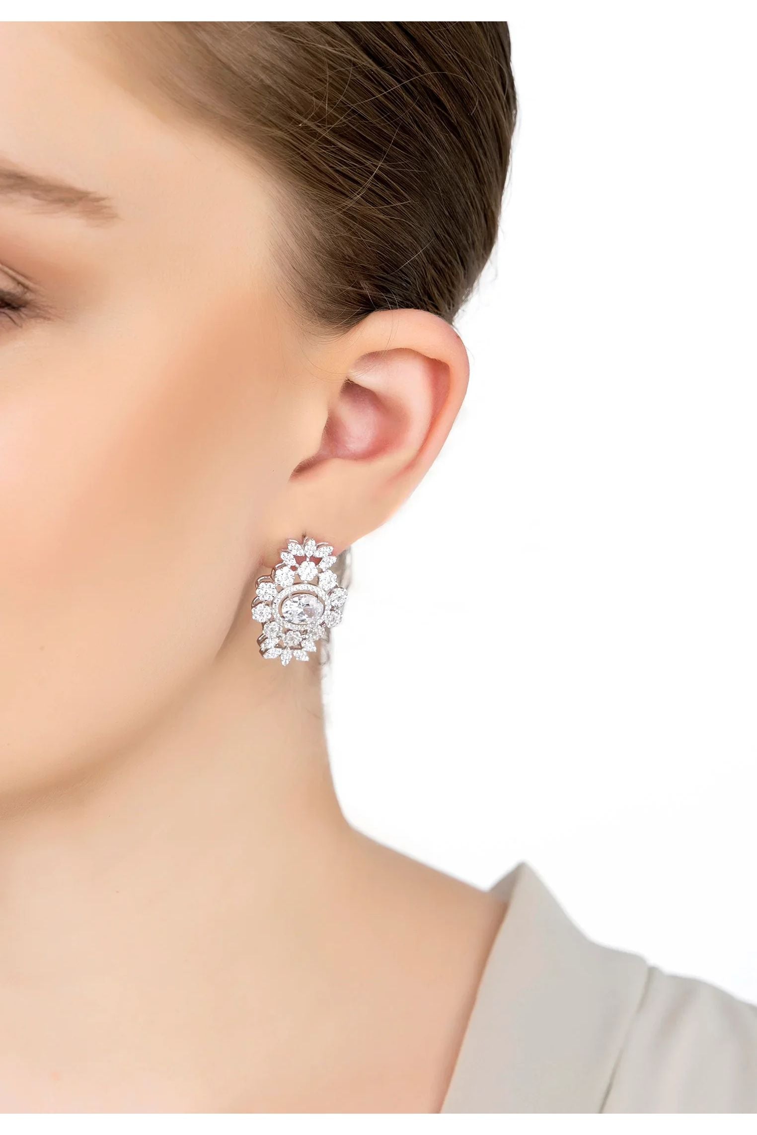The earring worn by a model.