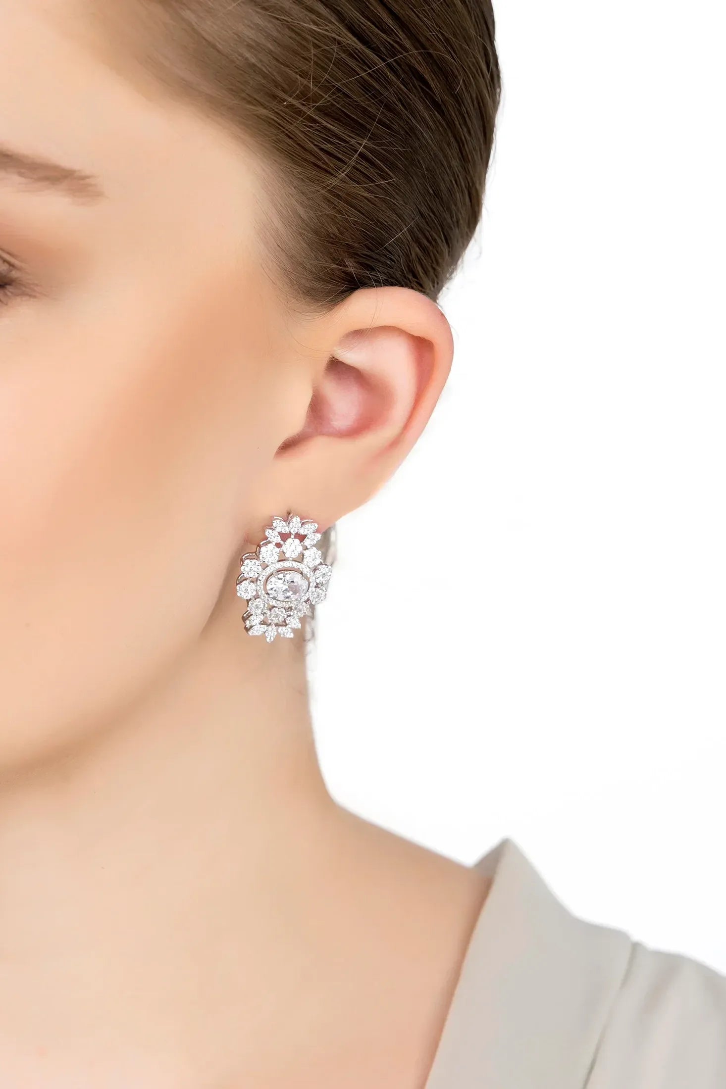The earring worn by a model.