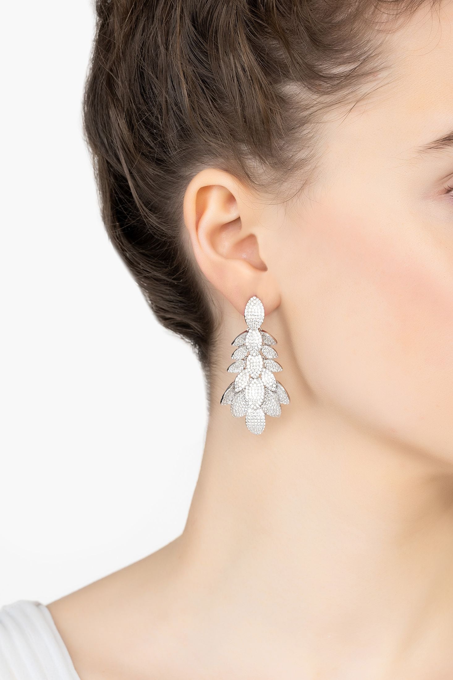 Angled view of Petal Cluster Drop Earrings Silver, showing silver finish and the jewellery profile.