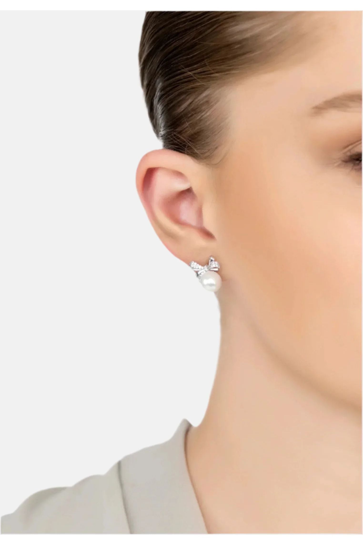 The earring worn by a model.