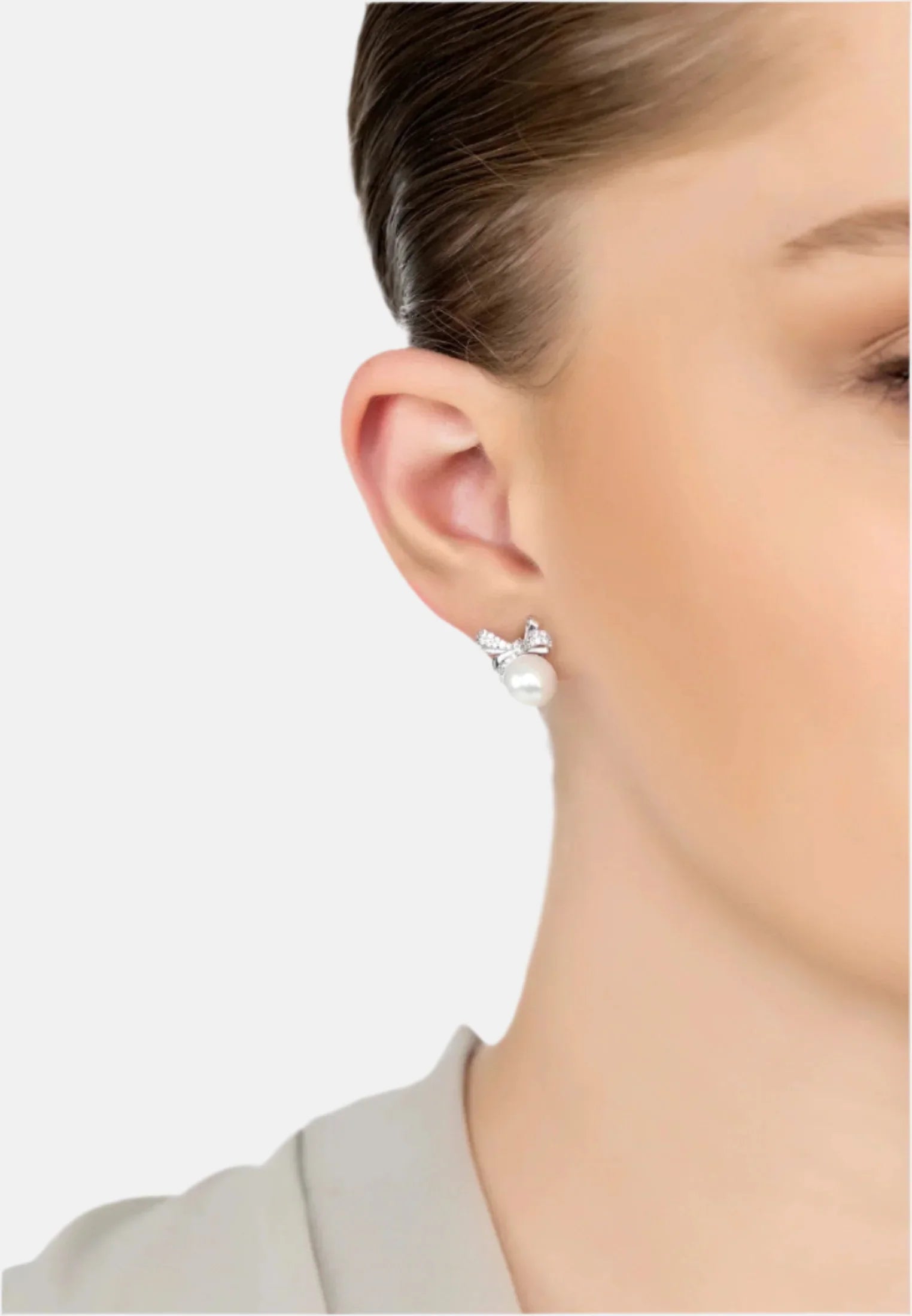 The earring worn by a model.