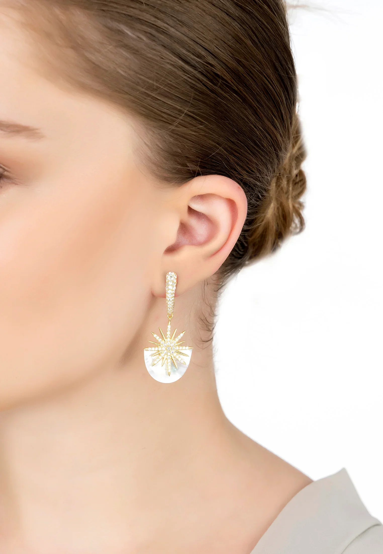 The earring worn by a model.