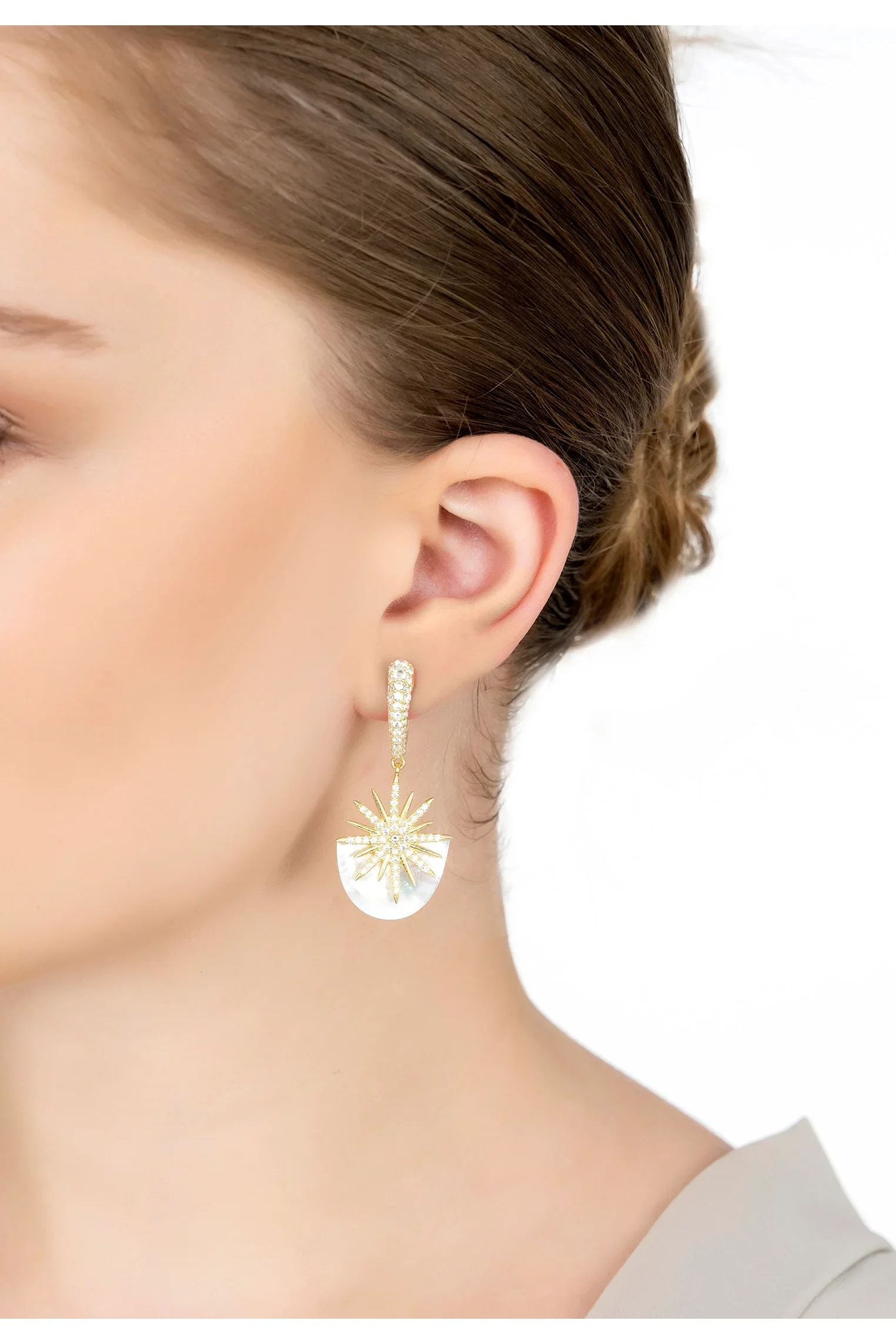 The earring worn by a model.
