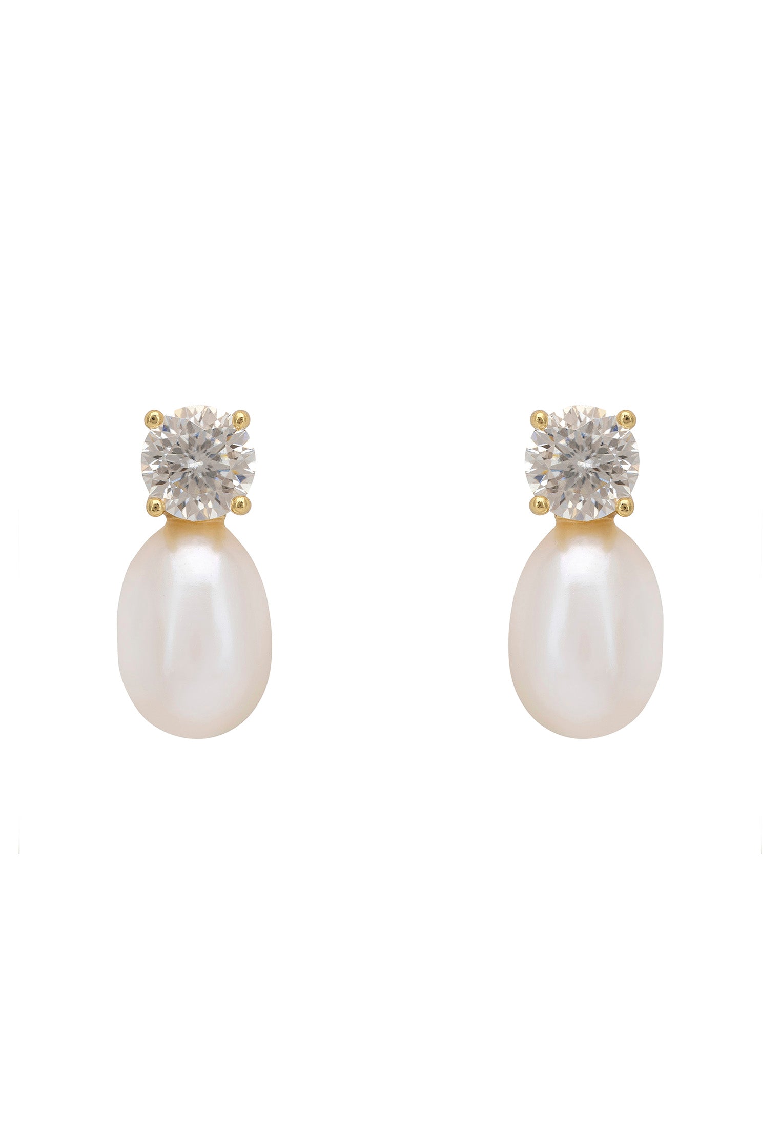 Pair of pearl earrings with diamond-like stone tops on a white background