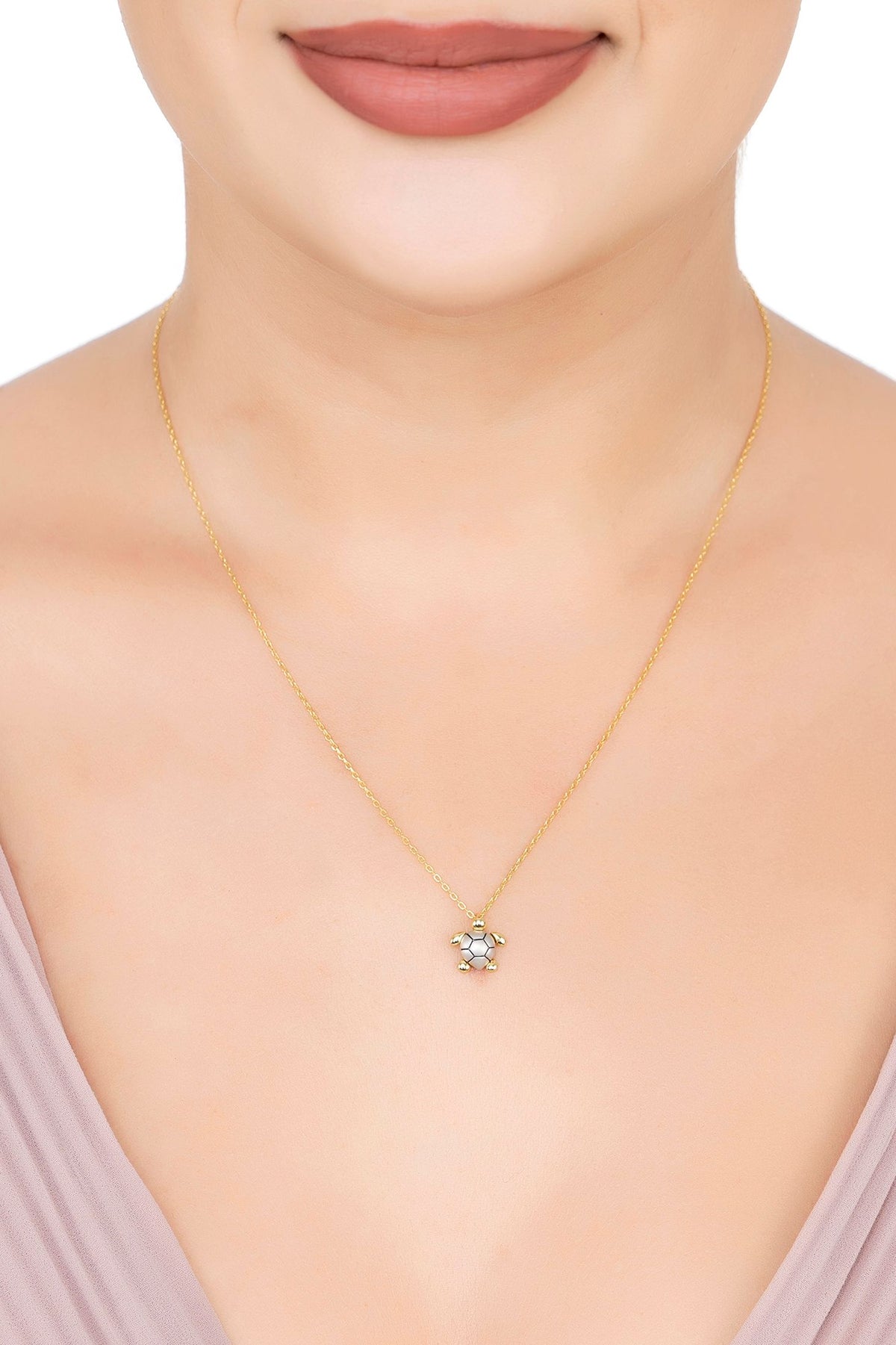 The necklace worn by a model.