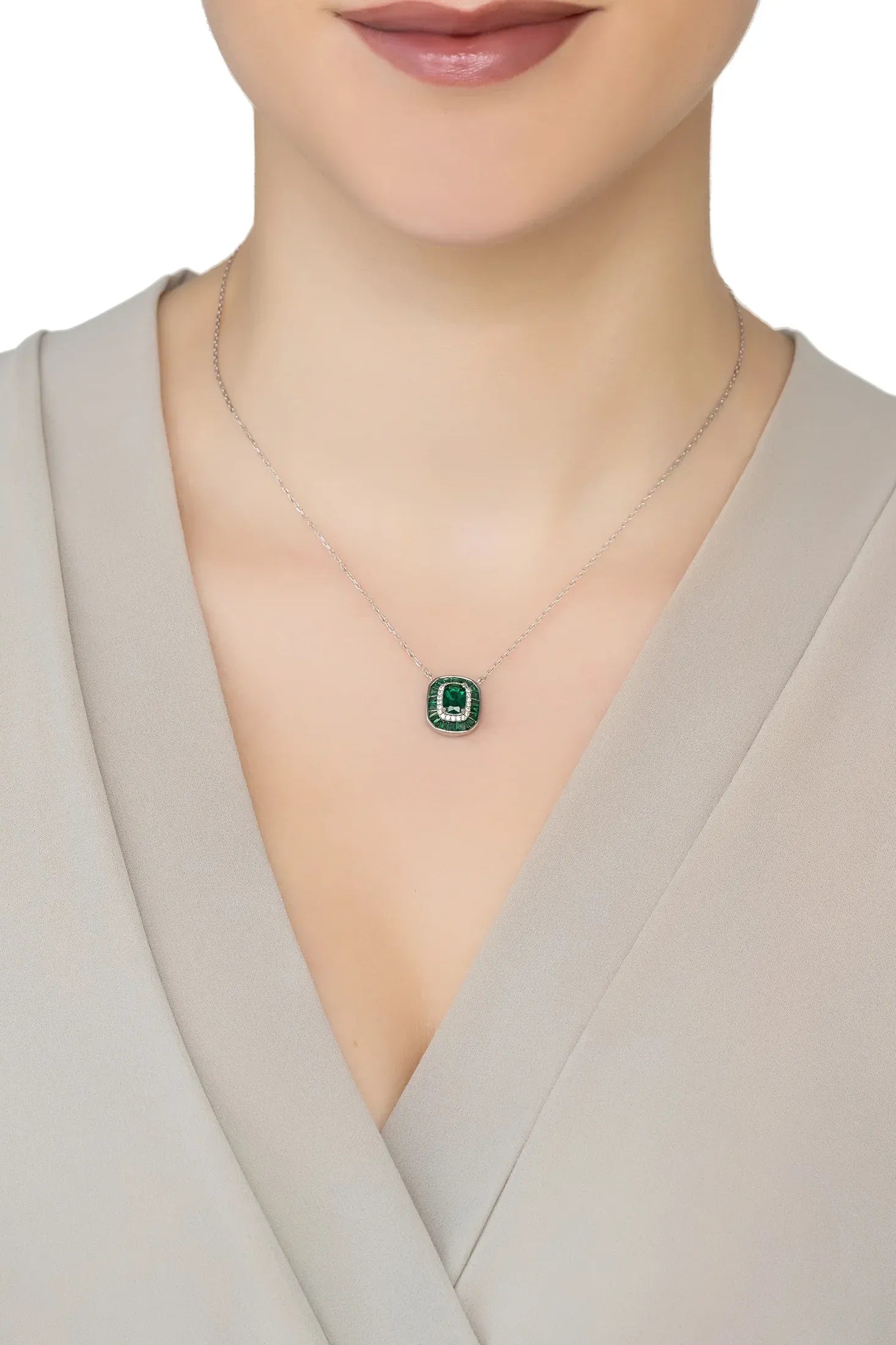 Angled view of Great Gatsby Pendant Necklace Emerald Silver, showing emerald detailing, silver finish and the jewellery profile.