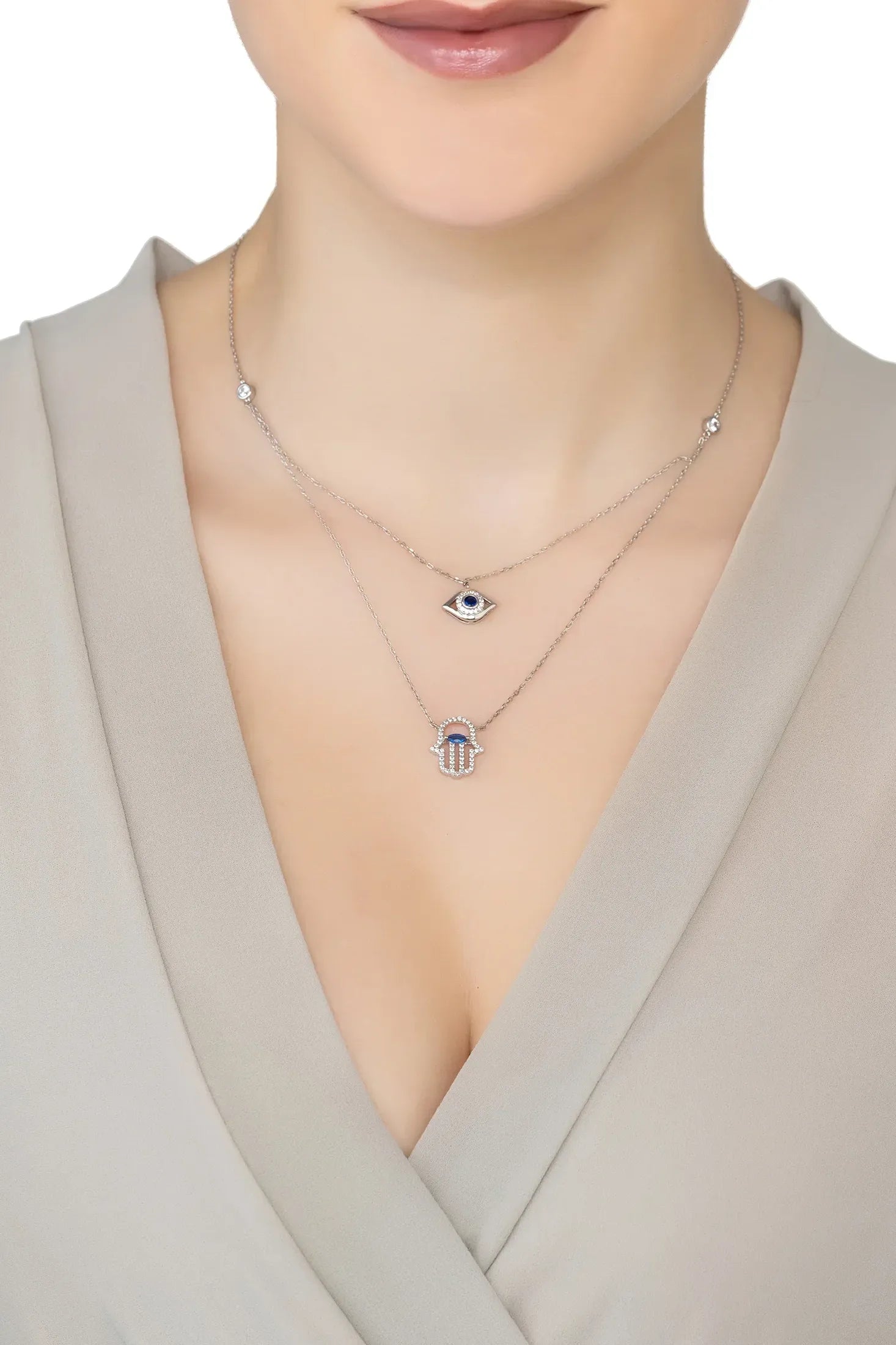 Angled view of Hamsa Hand And Evil Eye Layered Necklace Silver, showing evil eye design, silver finish and the jewellery profile.