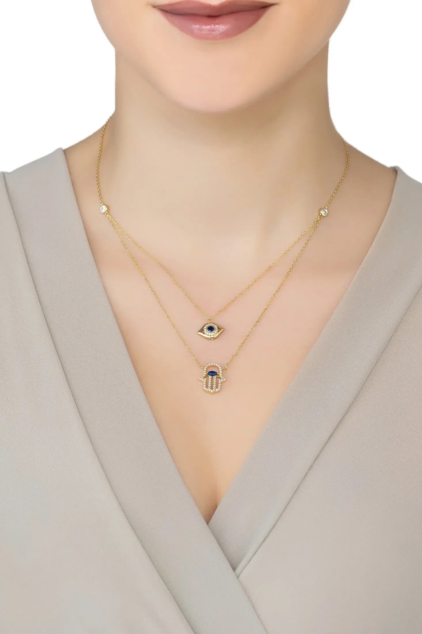 Angled view of Hamsa Hand And Evil Eye Layered Necklace Gold, showing evil eye design, gold finish and the jewellery profile.