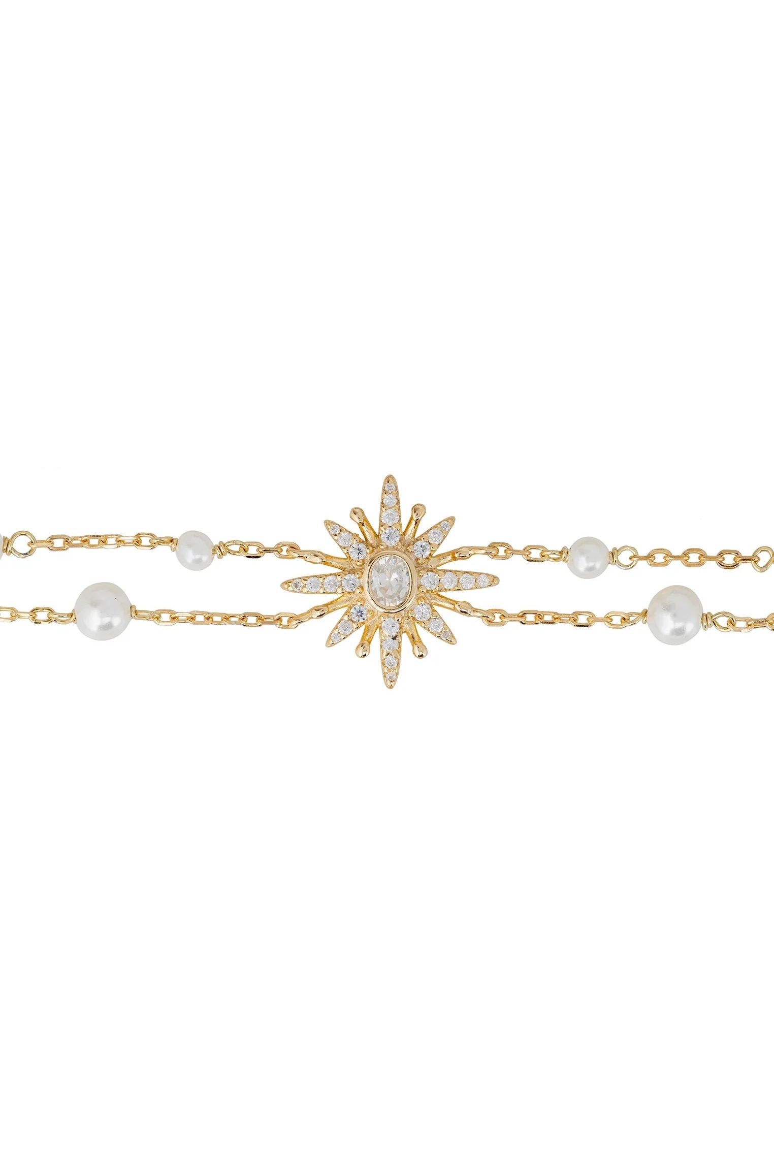Diamond and gold starburst bracelet with pearls.