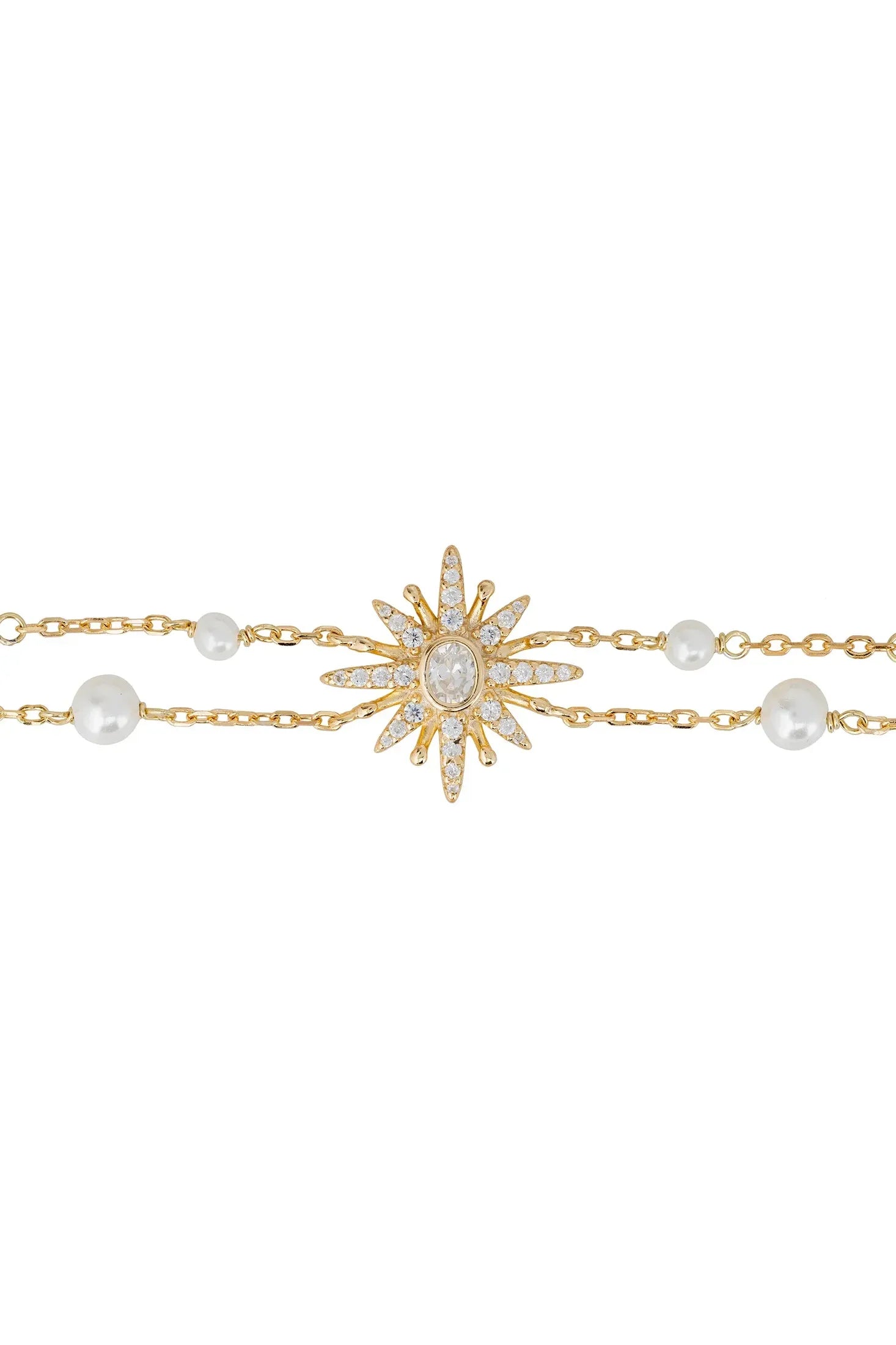 Diamond and gold starburst bracelet with pearls.