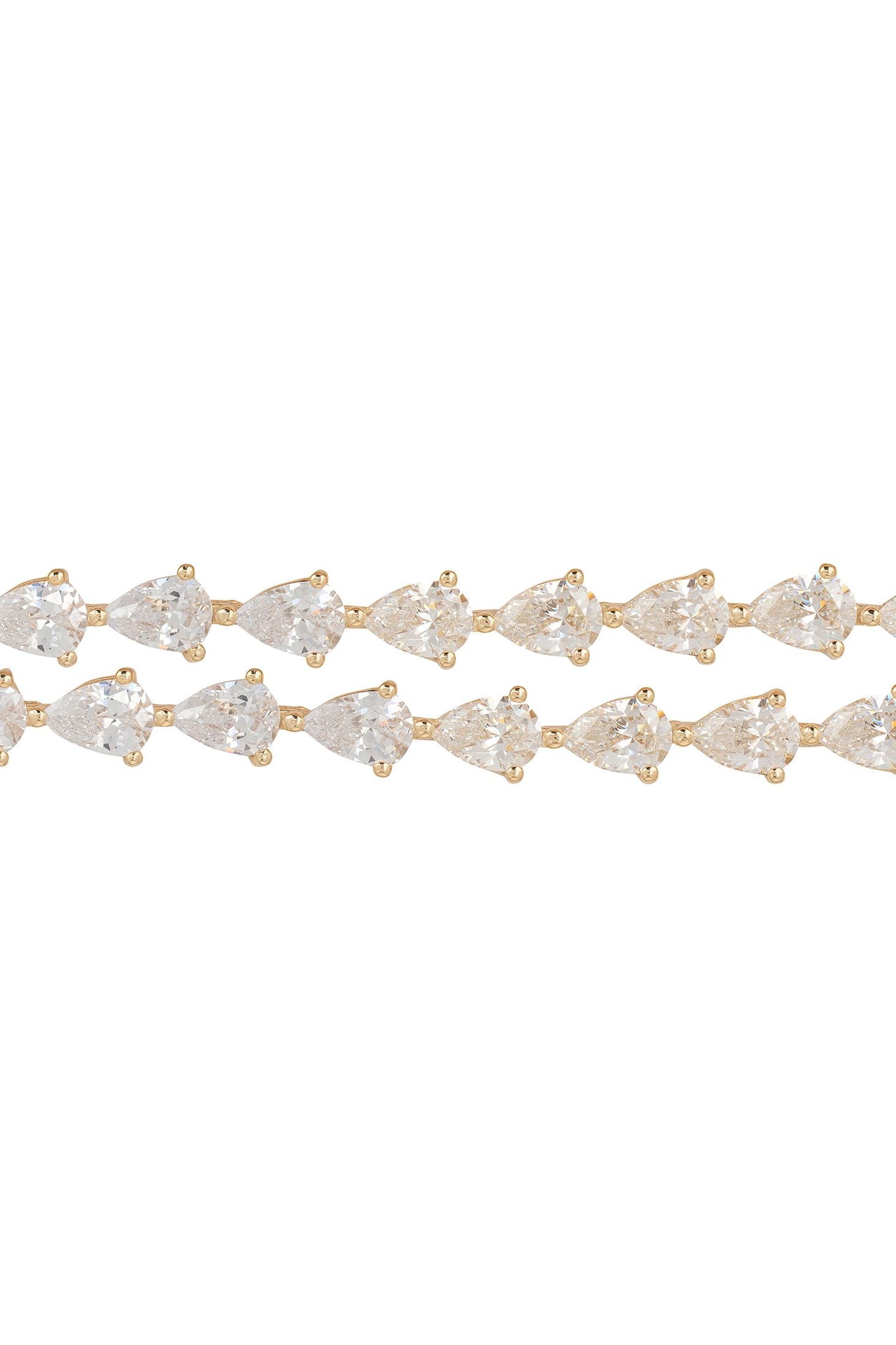 Gold bracelet with clear gemstones on a white background