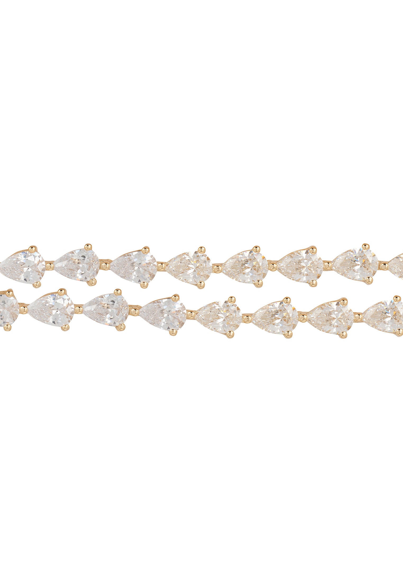 Gold bracelet with clear gemstones on a white background