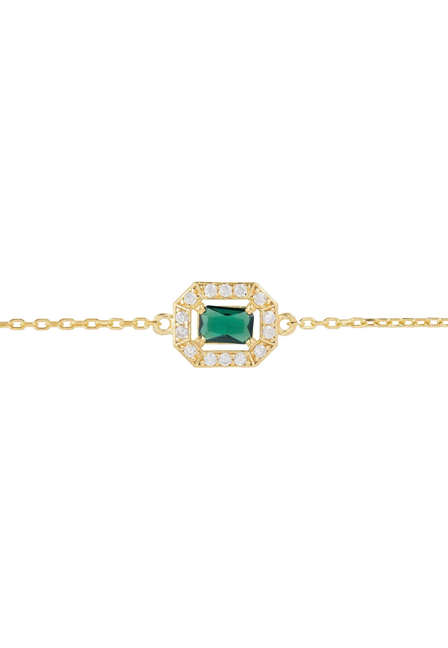 Diamond halo emerald charm gold bracelet.