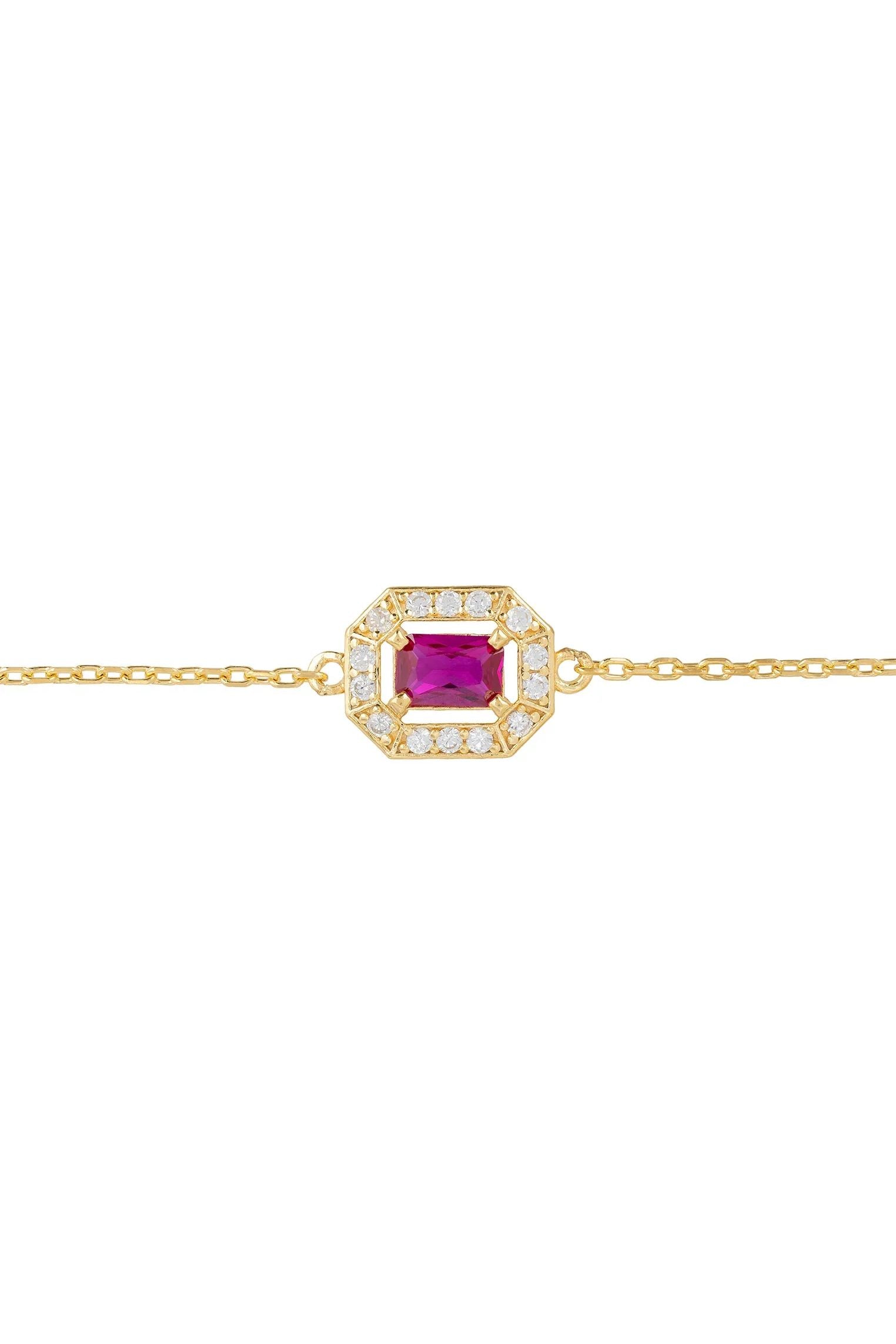 Diamond halo ruby charm gold bracelet.