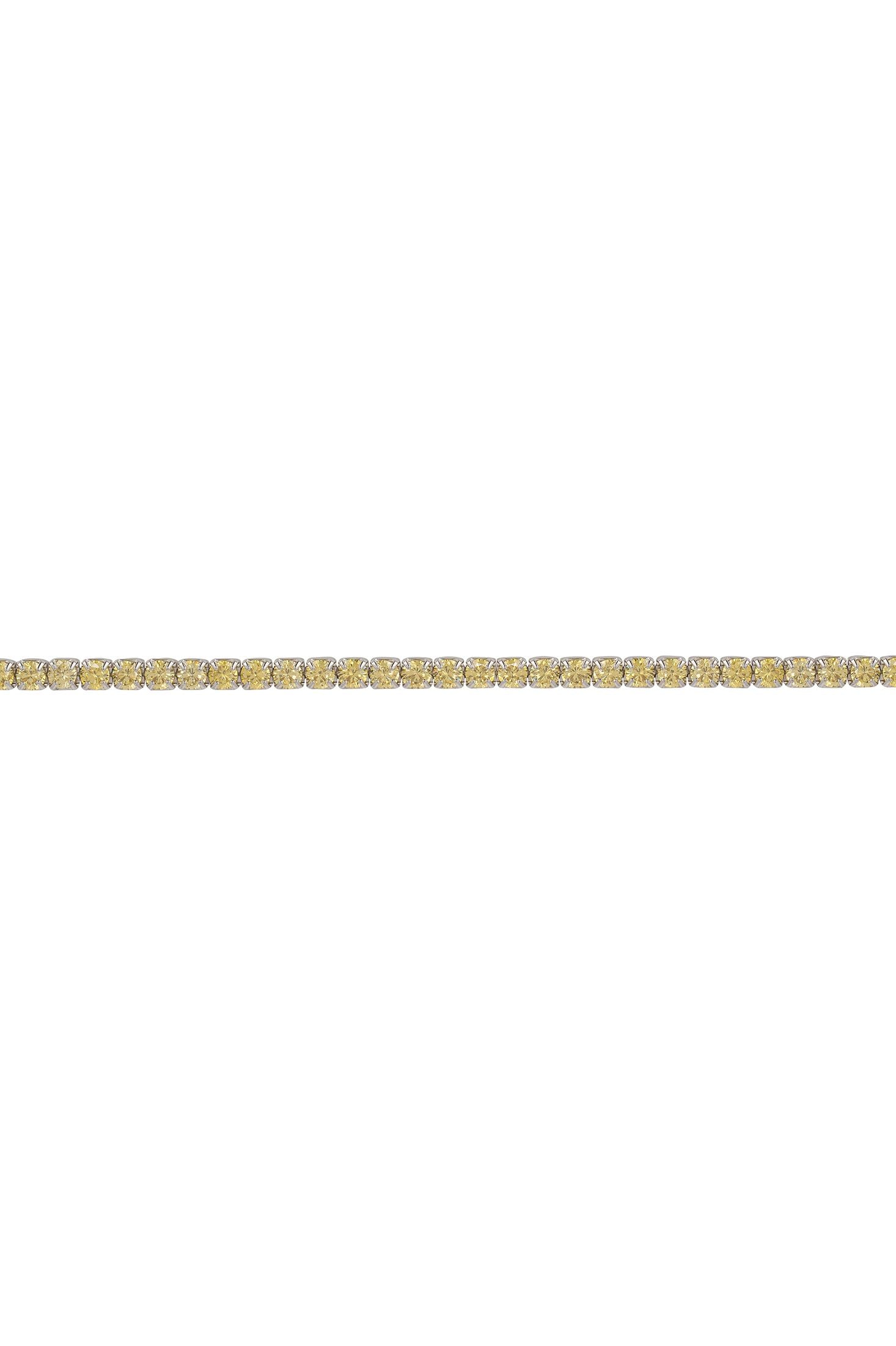 Gold bracelet with yellow stones on a white background