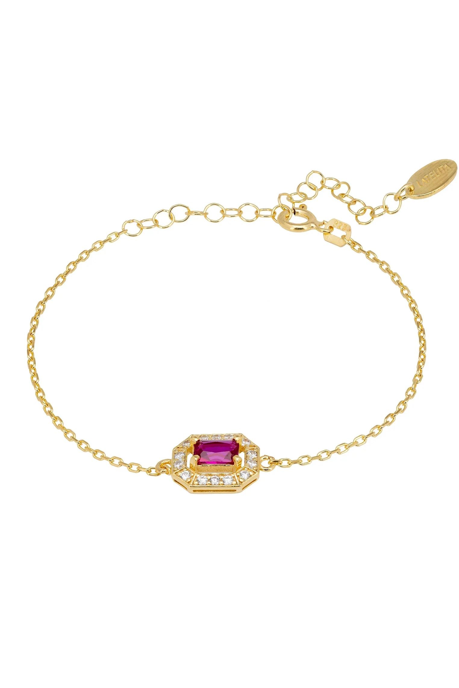 Diamond halo ruby charm gold bracelet.