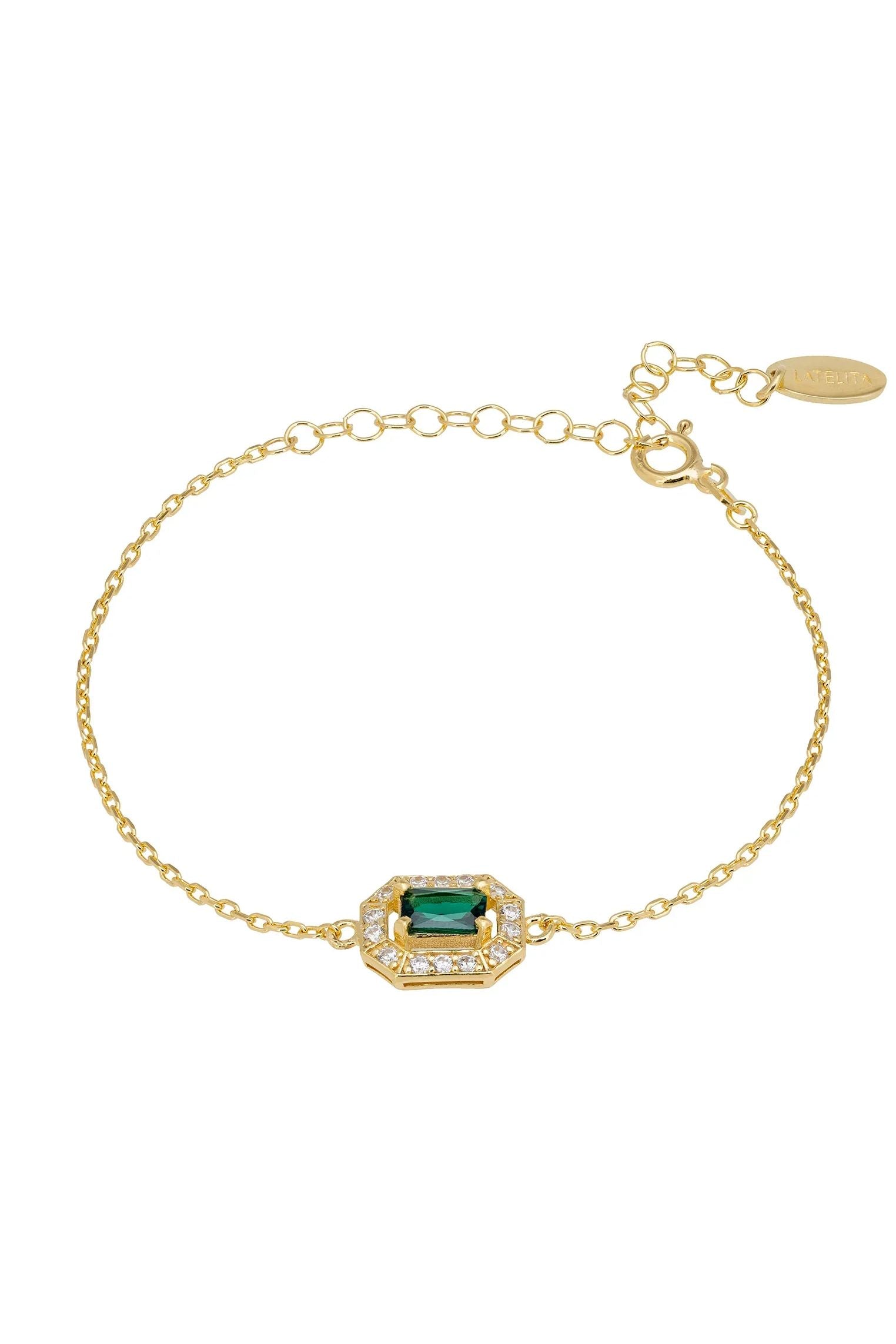 Diamond halo emerald charm gold bracelet.