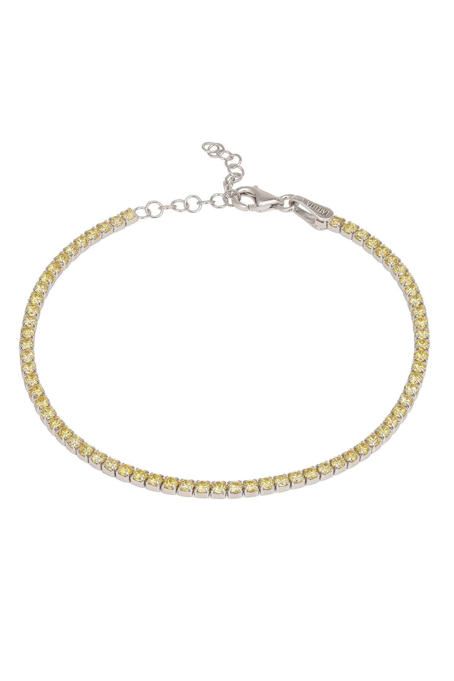 Gold bracelet with yellow stones on a white background