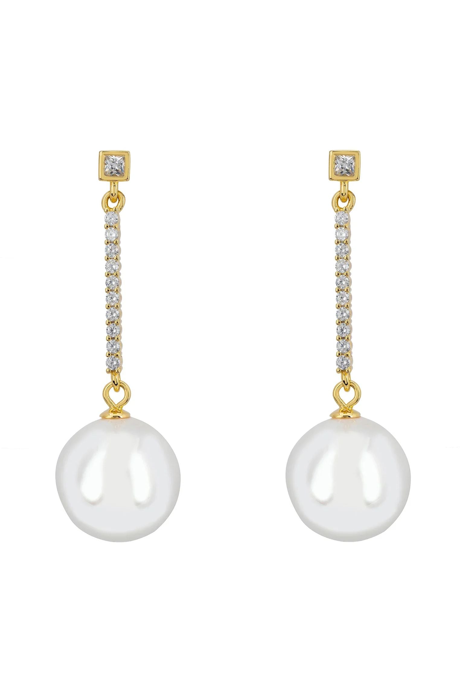 Gold string and pearl drop earrings.