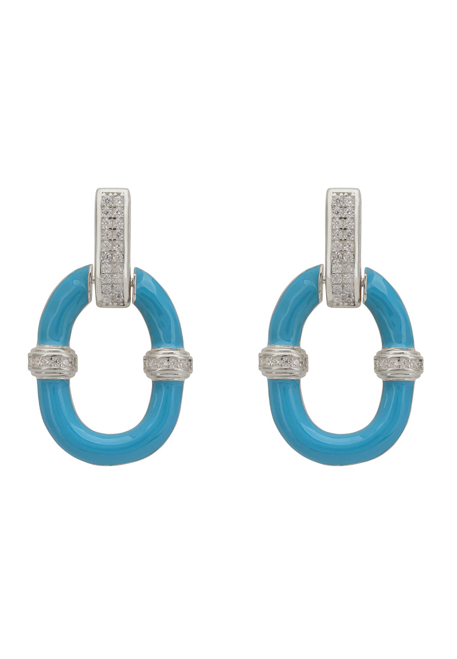 Pair of turquoise earrings with silver accents on a white background