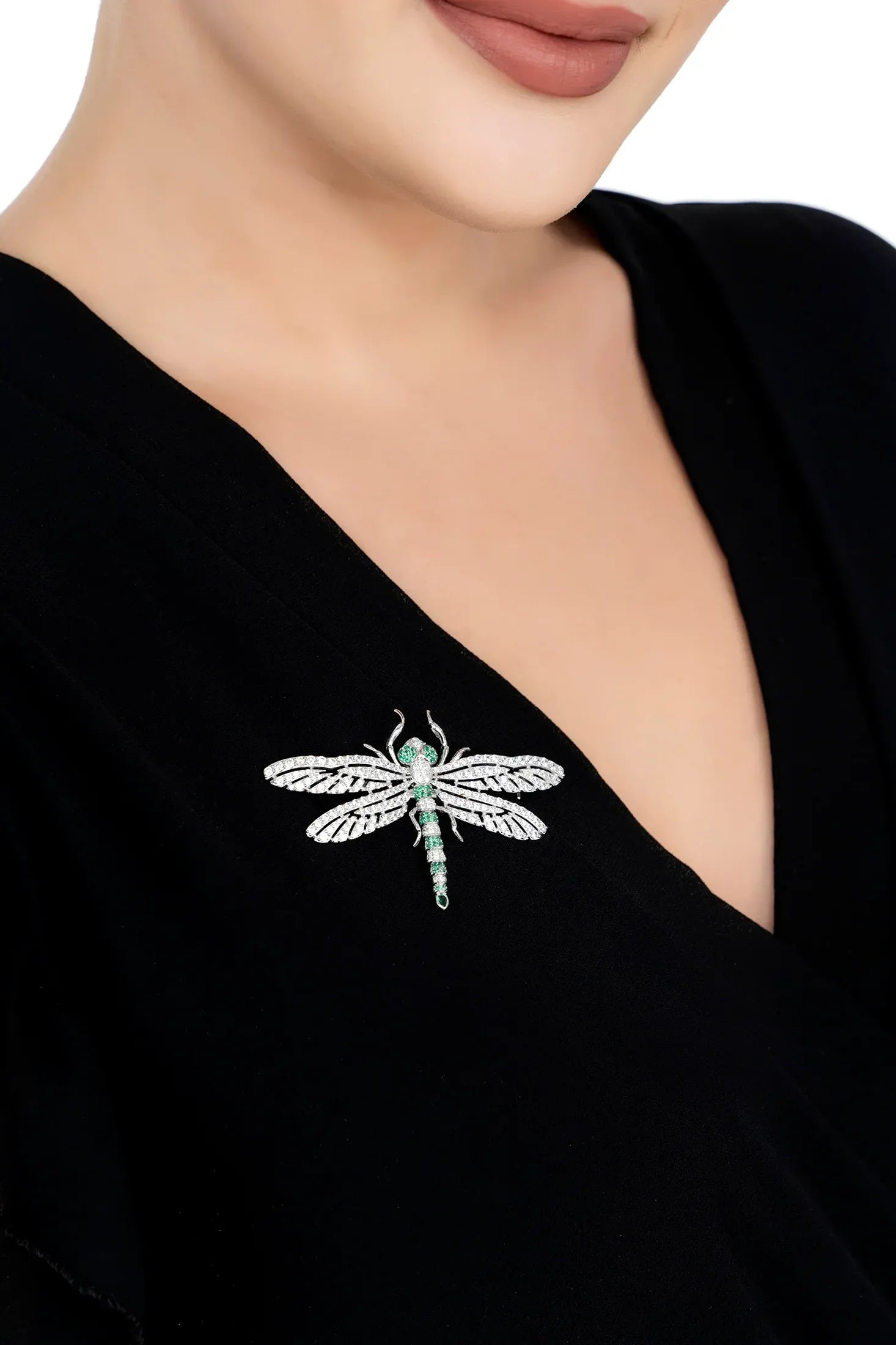 The brooch worn by a model.
