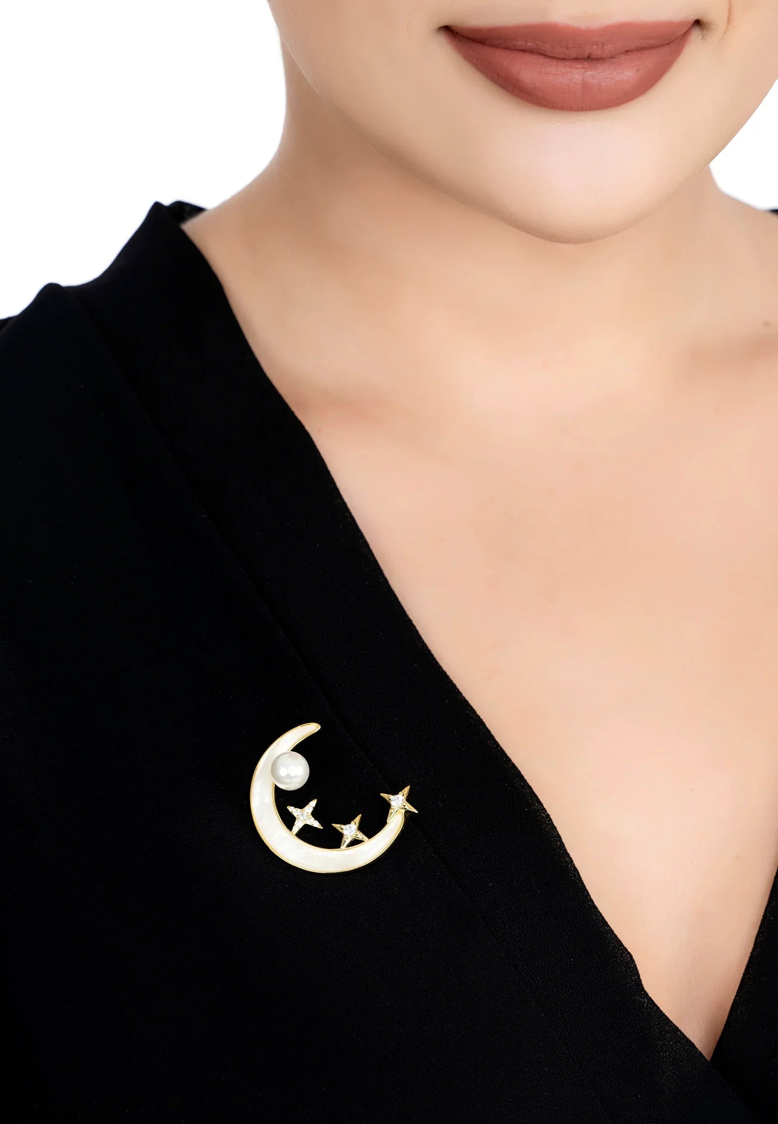 The brooch worn by a model.