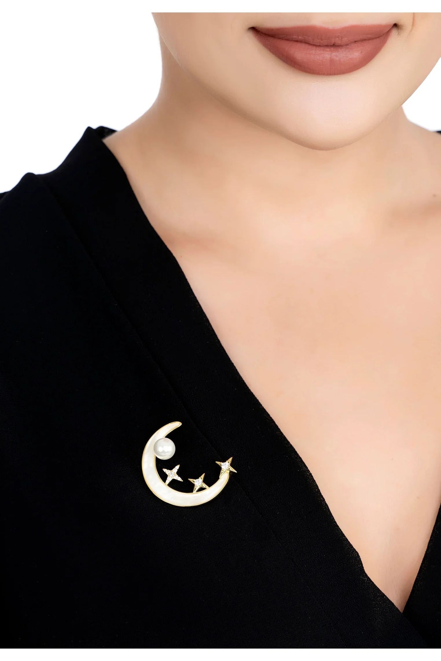 The brooch worn by a model.