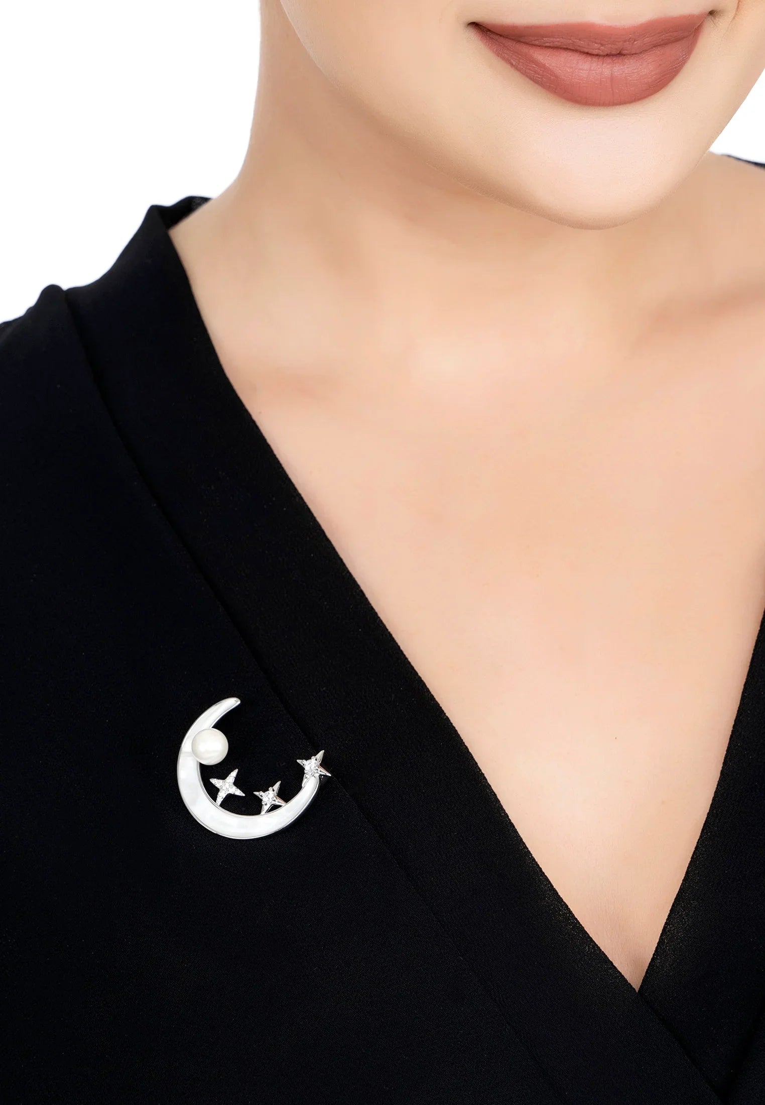 The brooch worn by a model.