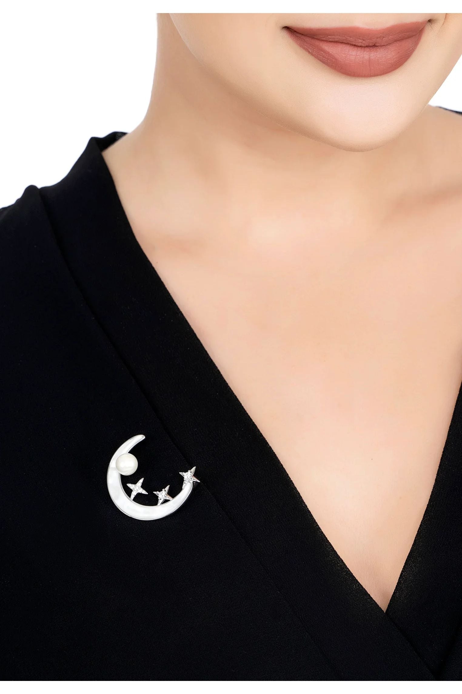 The brooch worn by a model.