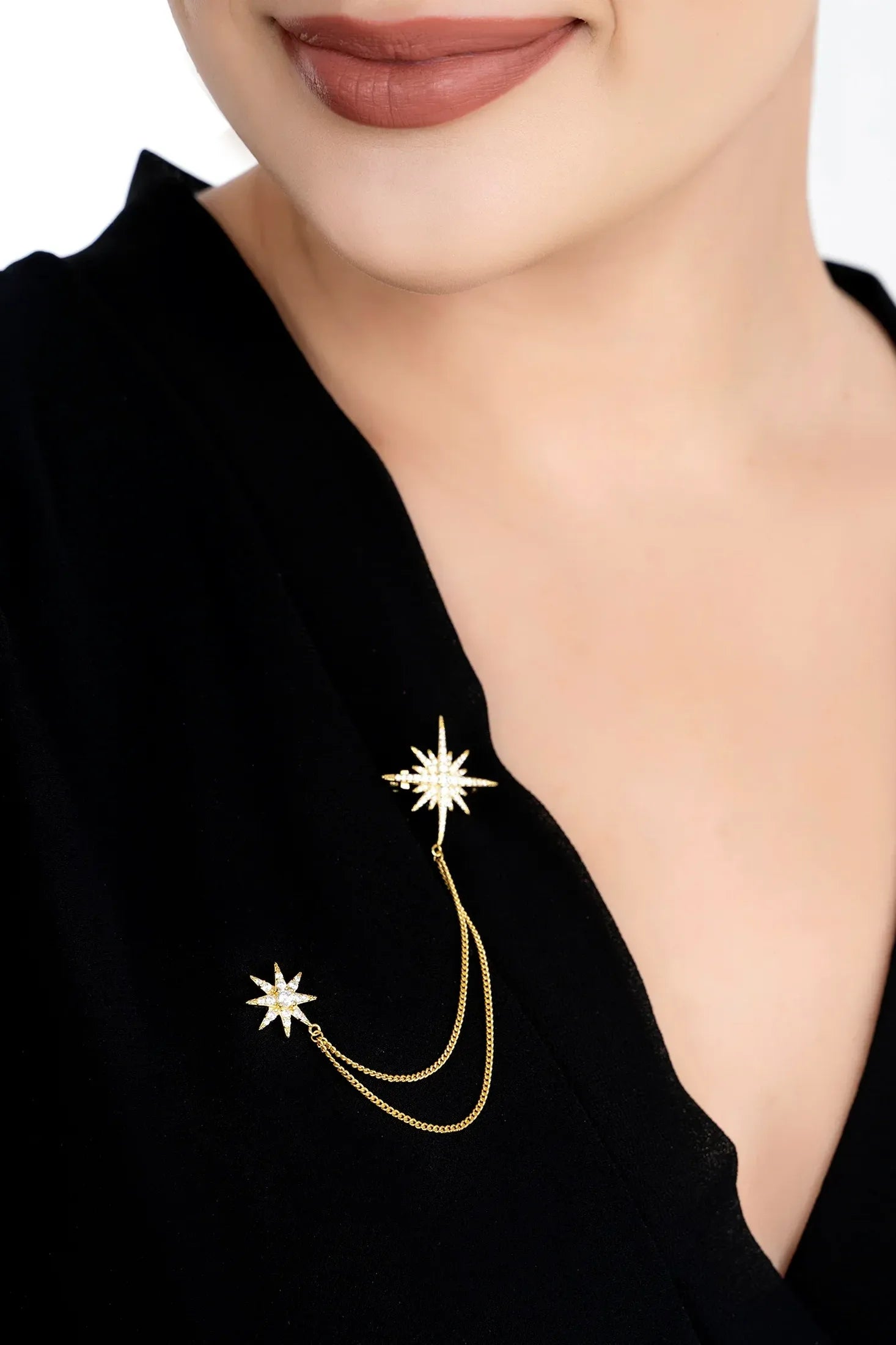 The brooch worn by a model.