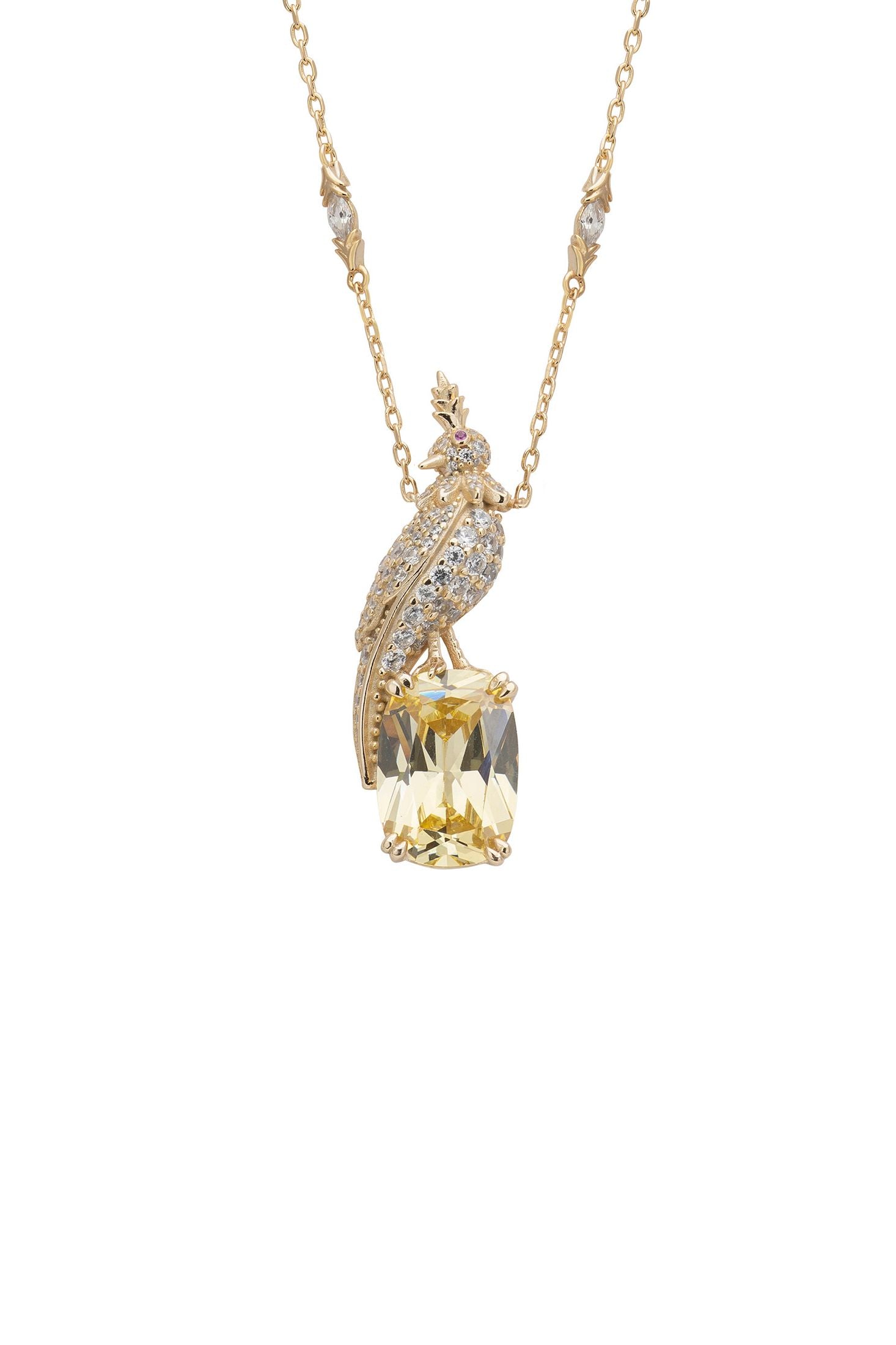 Gold necklace with a yellow gemstone pendant on a white background