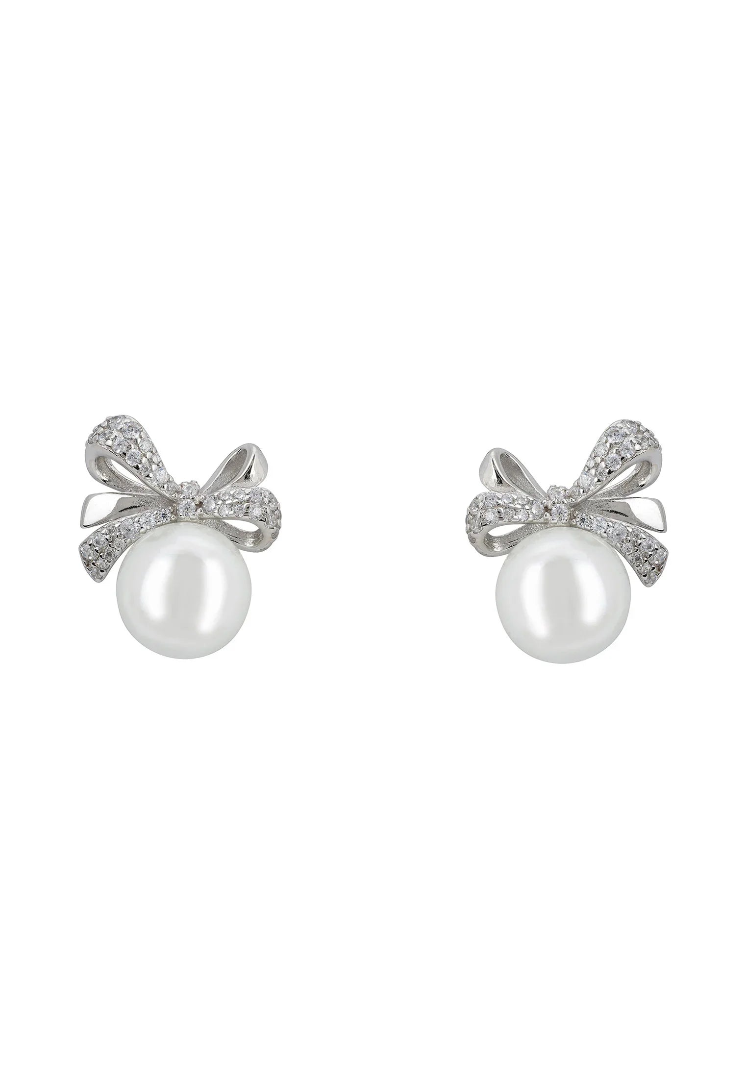 Pearl and silver bow stud earrings.