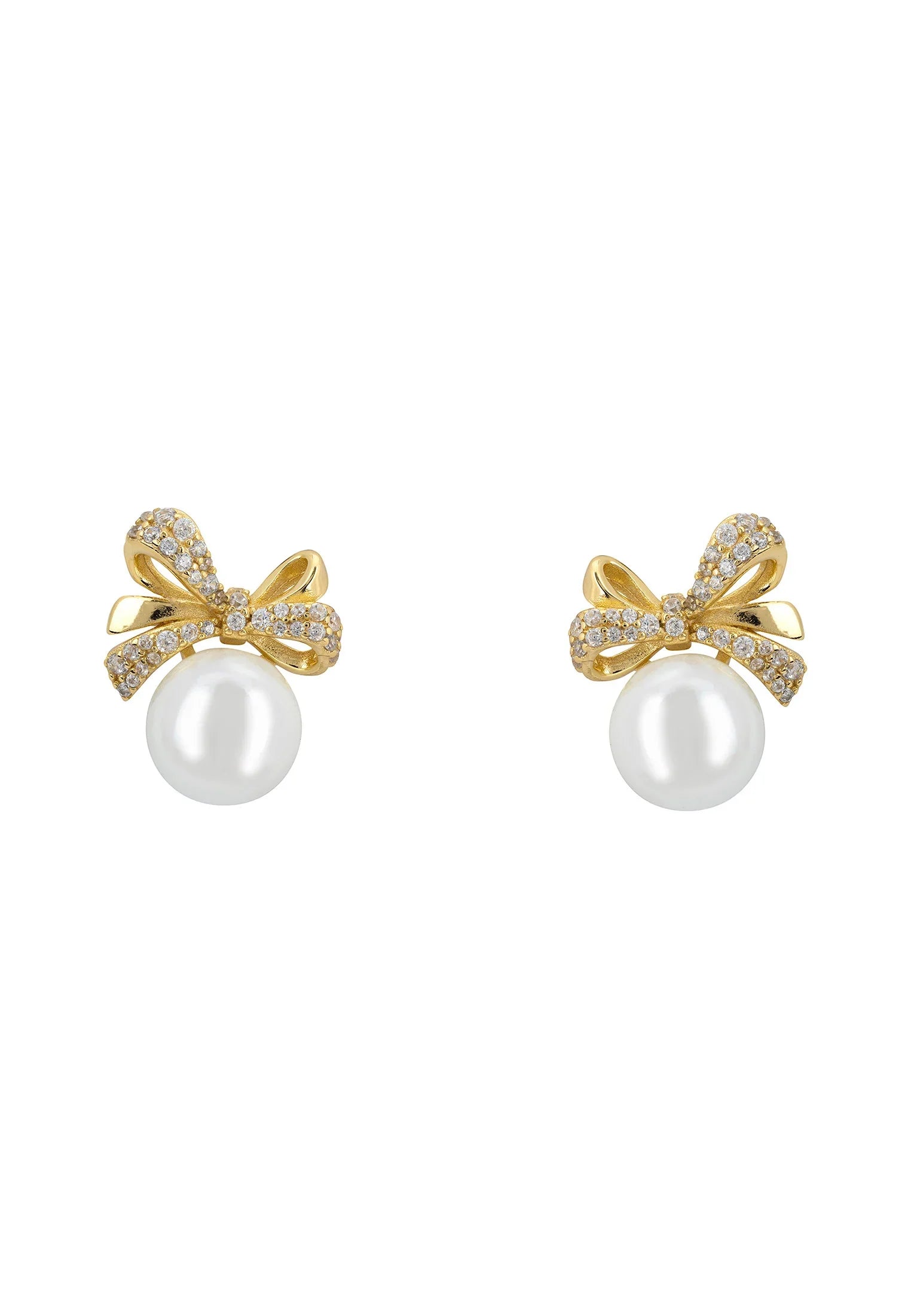 Pearl and gold bow stud earrings.