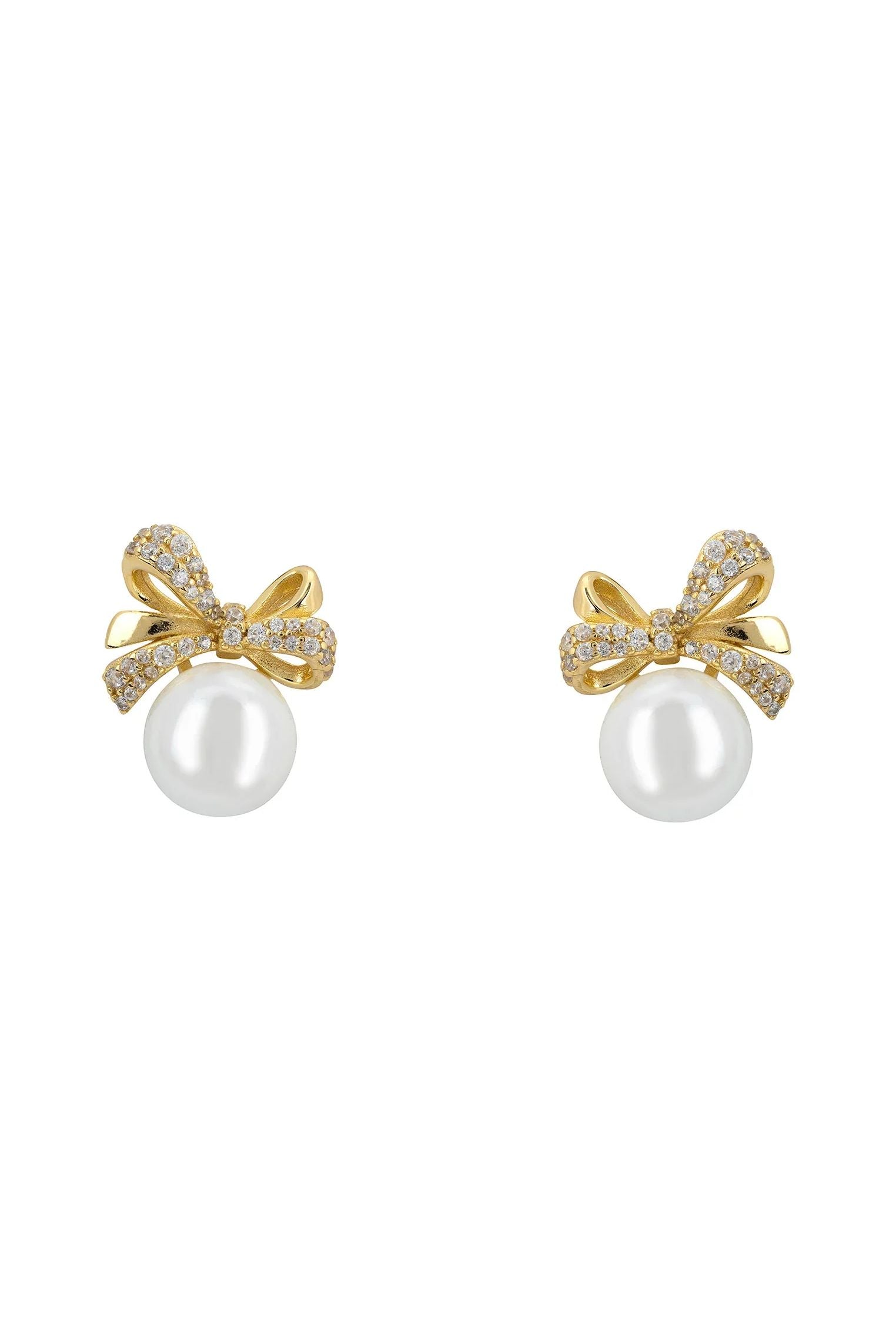 Pearl and gold bow stud earrings.